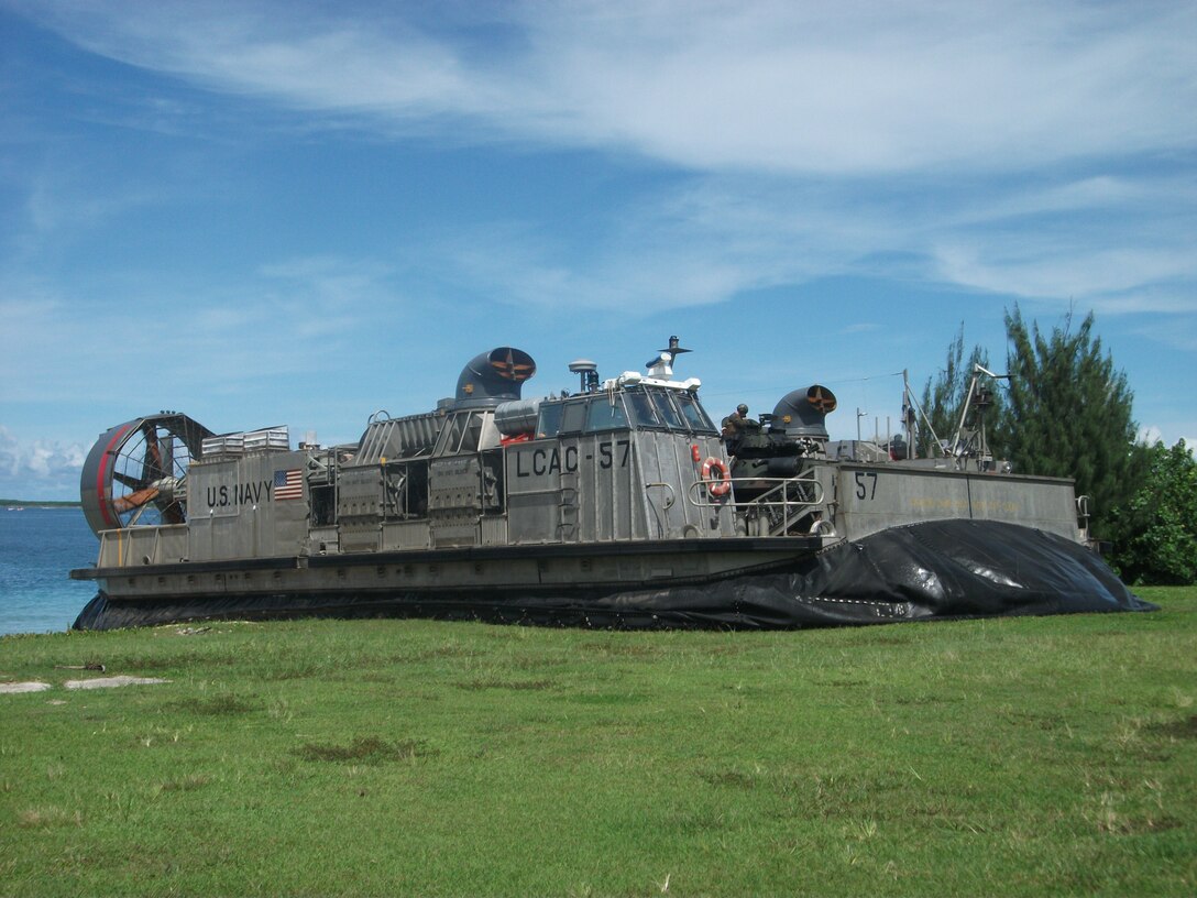 September 19, 2010, a Landing Craft Air Cushion (LCAC) with the dock landing ship U.S.S. Harpers Ferry (LSD 49), 31st Marine Expeditionary Unit (31st MEU), lands on shore during a boat raid on the coast of Guam in support of exercise Valiant Shield, which is part of a certification exercise conducted by the 31st MEU.