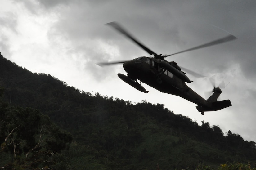A U.S. Army UH-60 Blackhawk helicopter circles as it approaches the landing zone to pick up people and supplies returning from medical operations in remote, mountainous Costa Rica Sept. 11, 2009. A team of members representing the Costa Rica Ministry of Health and Joint Task Force-Bravo provided medical care and education to nearly 400 patients in need during the two-day exercise. (U.S. Air Force photo/Tech. Sgt. Mike Hammond)