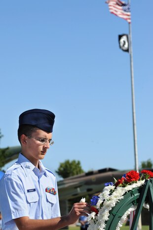 NELLIS AIR FORCE BASE Nev.,-- A member from the Rancho High School Junior Reserve Officer Training Corps places a flower on a wreath during the annual Prisoners of War/Missing in Action Remembrance Ceremony in honor of National POW/MIA Recognition Day at Freedom Park on Nellis Air Force Base, Sept. 18.
(U.S. Air Force photo by Lawrence Crespo)