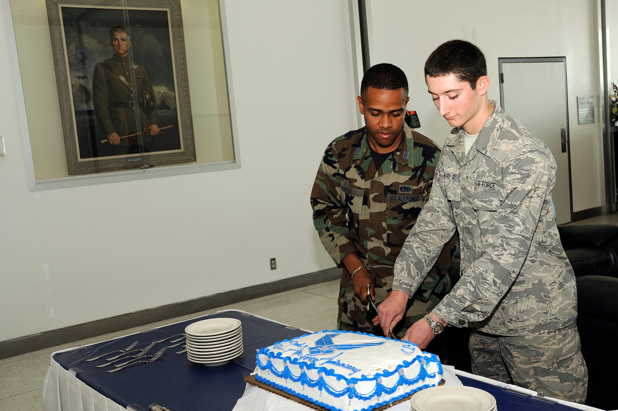 Cadet 1st Class Christopher Hunter from Cadet Squadron 33 and Cadet 4th Class Timothy Ambard from Cadet Squadron 38 cut a cake during a party for the Air Force's 62nd birthday at the U.S. Air Force Academy in Colorado Springs, Colo., Sept. 18, 2009. Cadet Hunter is the oldest attending Academy cadet, and Cadet Ambard is the youngest. (U.S. Air Force photo/Mike Kaplan)