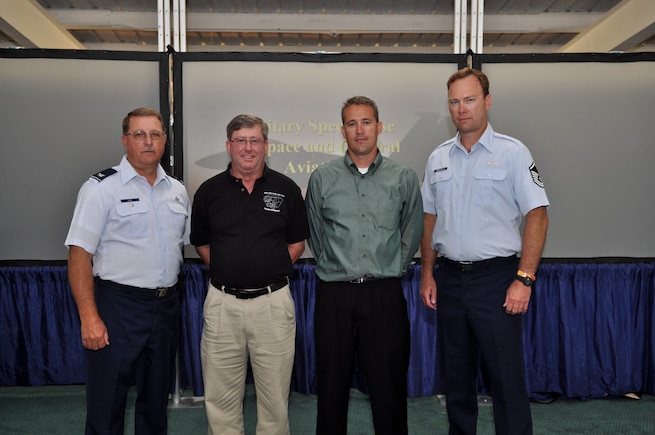 OSHKOSH, Wis. (Left to right) Col. Wayne Lee, Utah Air National Guard Headquarters, Mr. James Callahan, 57th Wing, Nellis Air Force Base,  Capt. Todd Lobato, 101st Information Operations Flight, Utah ANG, and Master Sgt. Hugh Marstella, 151st Air Refueling Wing flight safety, pose for a photo at a recent SeeAndAvoid.org ceremony here.  Captain Lobato was appointed as the DOD program manager for SeeAndAvoid.org on July 30. 