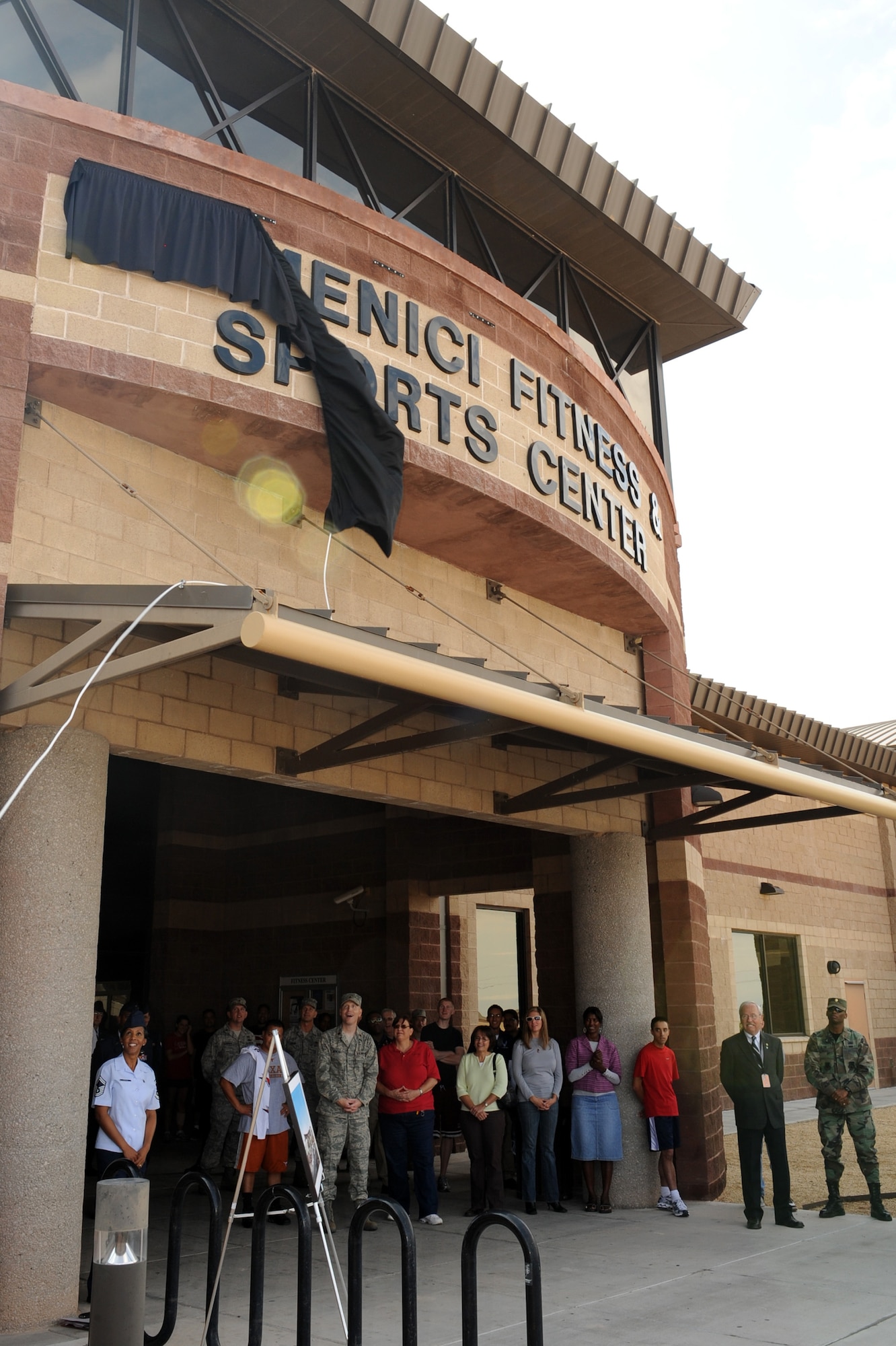 HOLLOMAN AIR FORCE BASE, N.M. -- Pete Domenici, retired U.S. senator for New Mexico, is welcomed to the new Domenici Fitness and Sports Center here Sept. 18. The 49th Fighter Wing officially renamed the Holloman Fitness and Sports Center to honor the six-term U.S. Senator. (U.S. Air Force photo by Senior Airman Rachel Kocin)