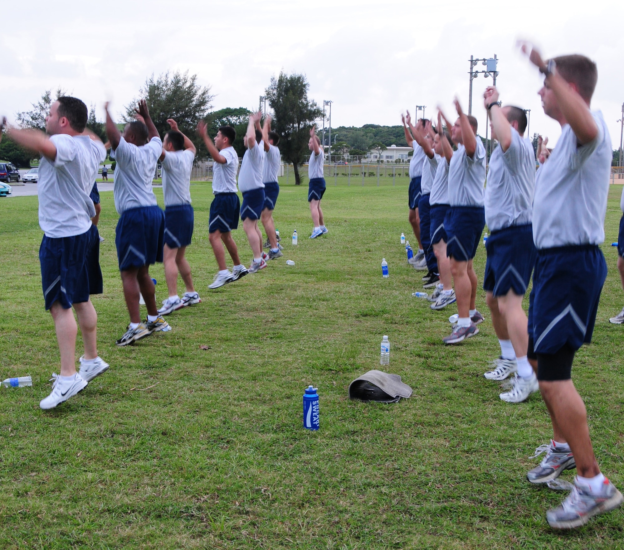 Members of the 18th Logistics Readiness Squadron integrate calisthenics into their weekly physical training Sept. 16, 2009, at Kadena Air Base, Japan. Along with their current PT program established around 2006, members are also encouraged to attend the healthy living class offered at the base health and wellness center. (U.S. Air Force photo/Staff Sgt. Lakisha Croley) 
