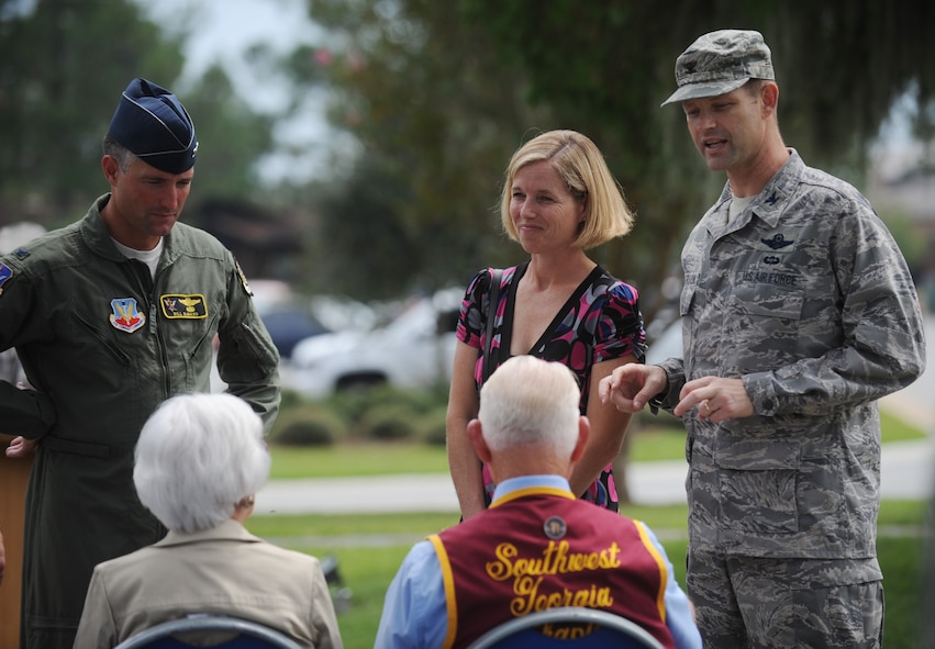 MOODY AIR FORCE BASE, Ga. -- Col. Gary Henderson, 23rd Wing commander, his wife Erin, and Col. William DeMaso, 23rd Wing vice commander, speak with retired 1st Lt. James Lee, the guest speaker for the Prisoner of War/Missing in Action Remembrance Day ceremony here Sept. 18.  (U.S. Air Force photo by Senior Airman Gina Chiaverotti-Paige)