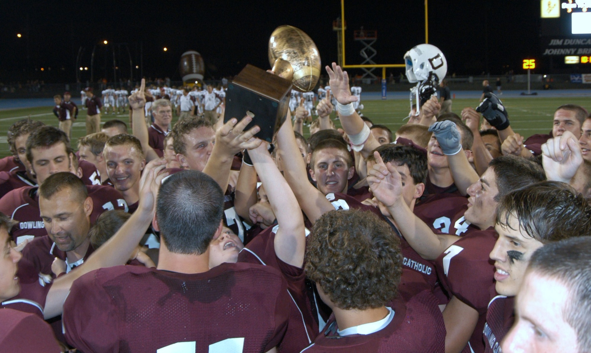 Dowling Catholic football players celebrate after defeating Valley High School 44-14 at Drake Stadium in Des Moines, Iowa Sept 4. Dowling Catholic was awarded the Great American Rivalry Series championship trophy for their win. Sponsored by the U.S. Air Force, the Series allows the Air Force to showcase how teamwork, dedication and commitment to excellence goes beyond the football field. (U.S. Air Force photo/Tech. Sgt. David McCarrison)