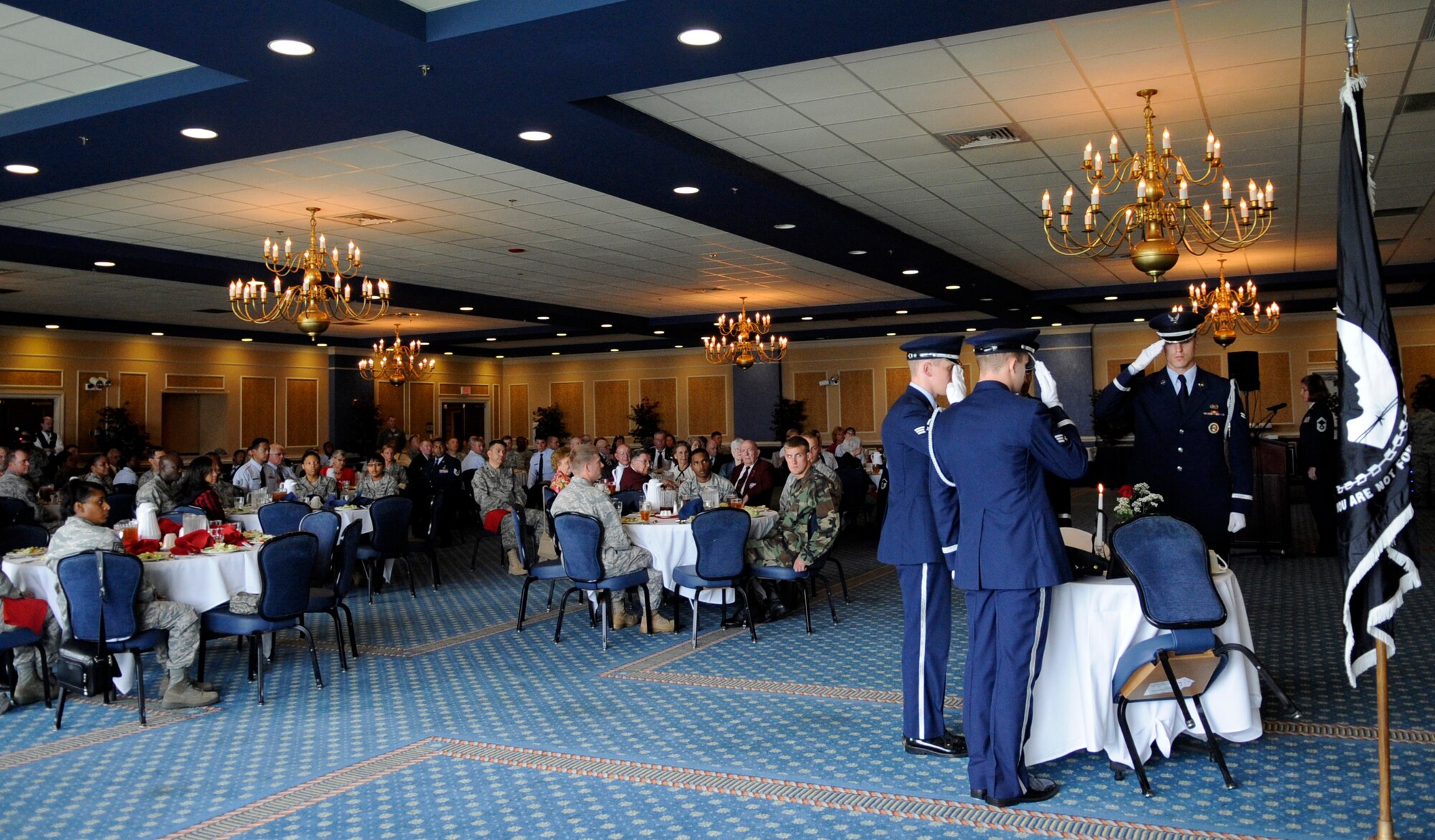 LANGLEY AIR FORCE BASE, Va.-- Members of the base honor guard perform for former prisoners-of-war at the Bayside Enlisted Club Sept. 18. Langley Airmen were able to meet with former POWs from World War II, the Korean War and Vietnam War. (U.S. Air Force photo/Senior Airman Dana Hill)