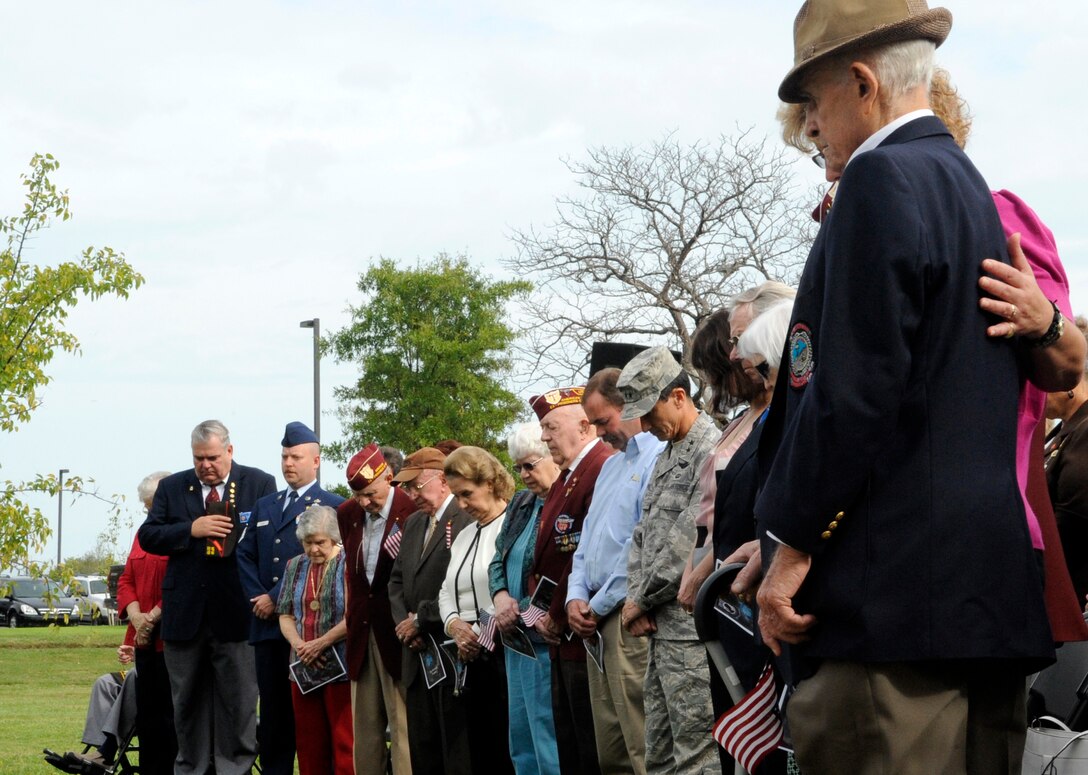 LANGLEY AIR FORCE BASE, Va. -- Former prisoners of war and Langley Airmen receive a invocation during the POW/Missing-in-Action Memorial dedication ceremony Sept. 18. Langley Airmen were able to meet with former POWs from World War II, the Korean War and Vietnam War. (U.S. Air Force photo/Senior Airman Dana Hill)