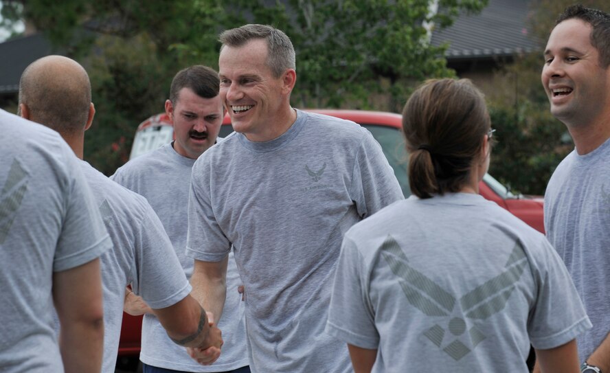 MOODY AIR FORCE BASE, Ga. -- Members of the 23rd Wing congratulate one another after participating in the 23-mile Tiger-thon run here Sept. 18. Individuals from various organizations on base joined together to run in the event. (U.S. Air Force photo by Senior Airman Schelli Jones) 
