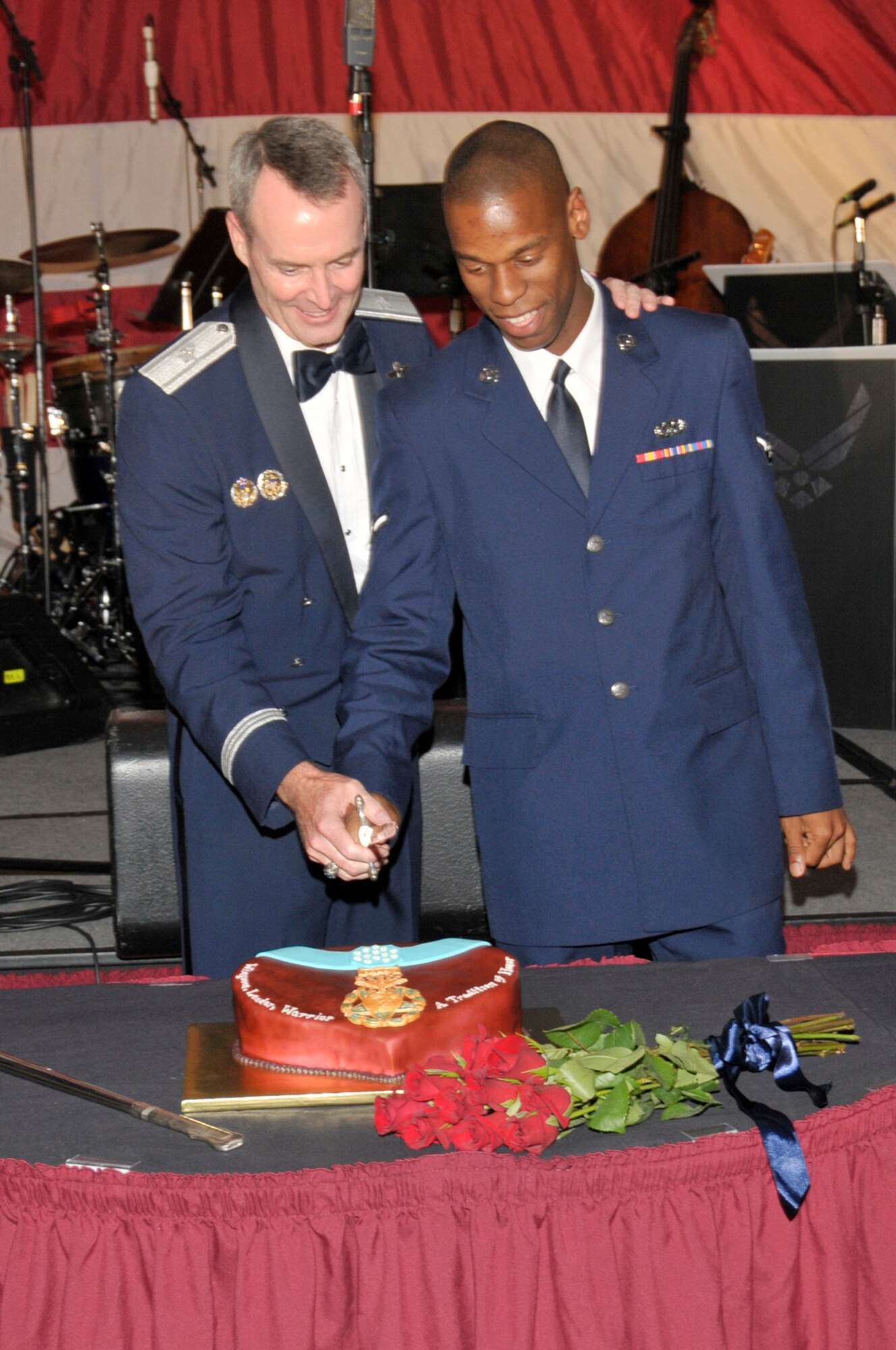 Brigadier General Darryl Roberson, 325th Fighter Wing Commander and Airman Jerylmayne White, 325th Air Maintenance Squadron F-15 Jet Engine Mechanic, perform the traditional cake cutting ceremony during the 62nf Air Force Ball. Sept. 11 at the Boardwalk Beach Resort in Panama City Beach, Fla. (U.S. Air Force photo courtesy of Lisa Norman)