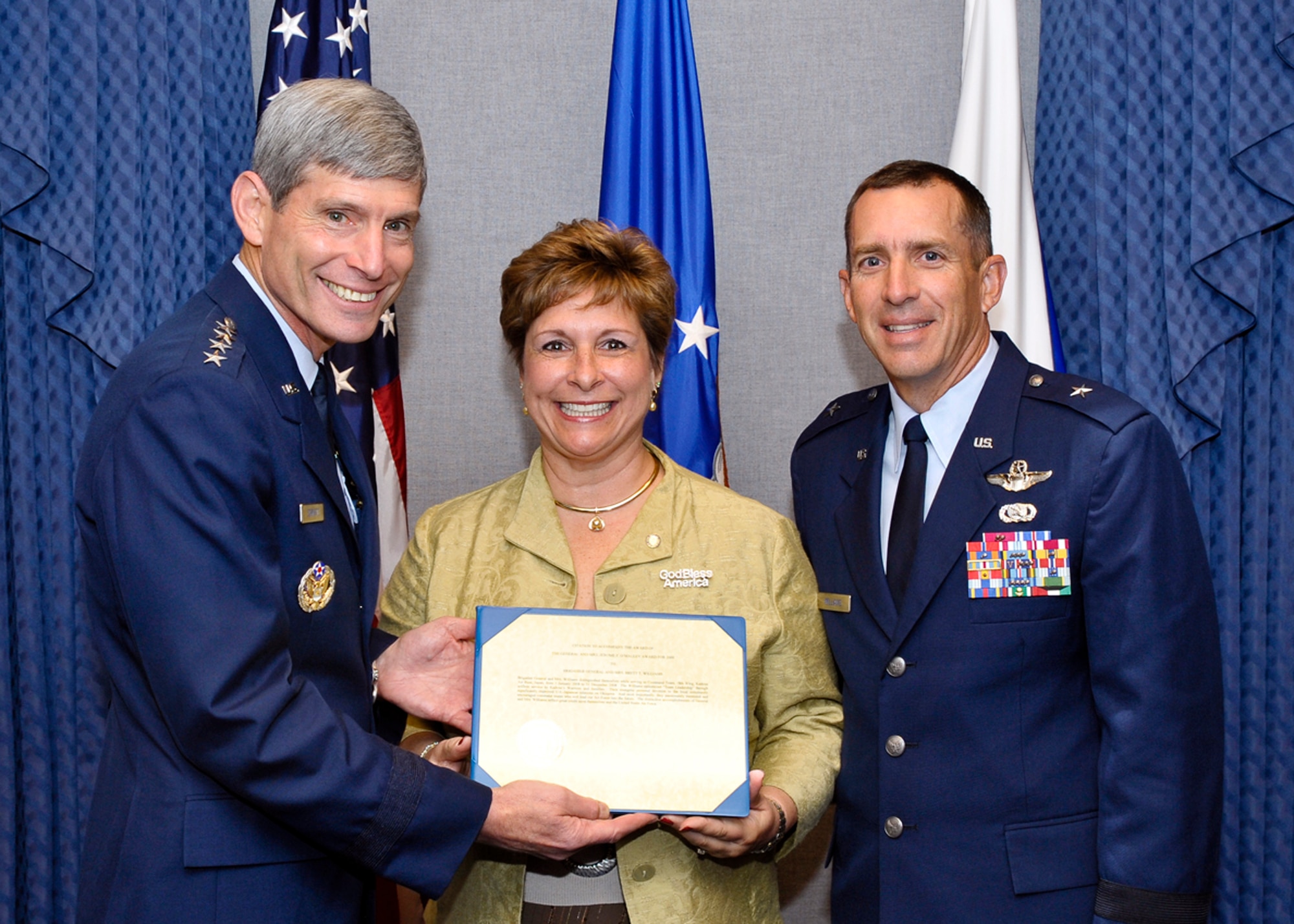 Air Force Chief of Staff Gen. Norton Schwartz presents the 2009 General and Mrs. Jerome F. O'Malley Award to Brig. Gen. Brett and Marianne Williams at a Pentagon ceremony Sept. 11, 2009.  (U.S. Air Force photo/Michael J Pausic)