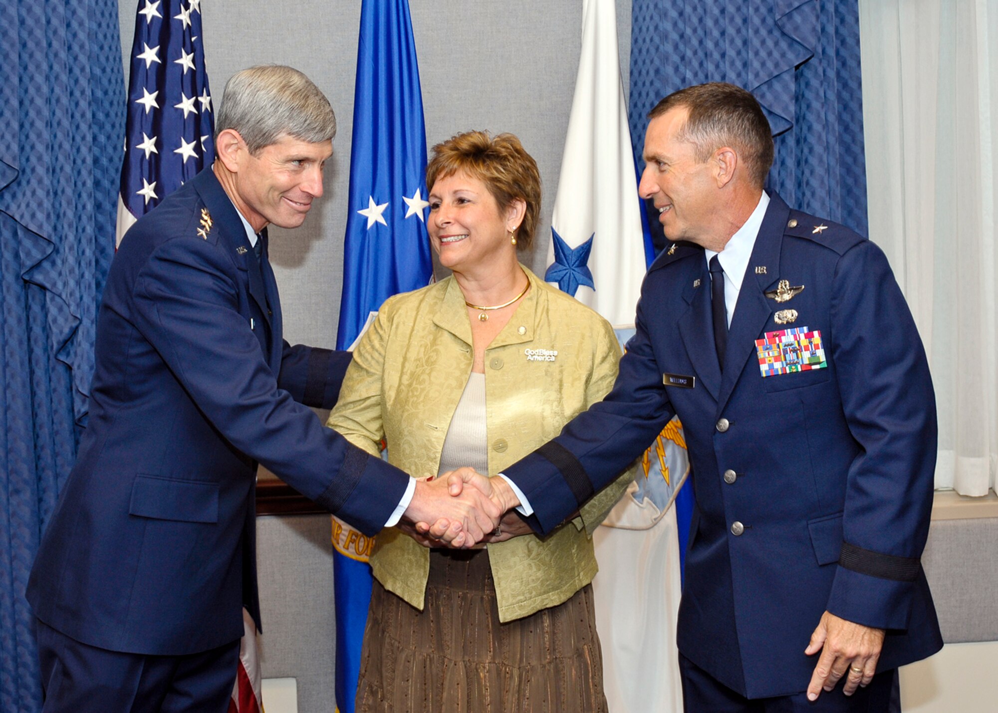 Air Force Chief of Staff Gen. Norton Schwartz congratulates Brig. Gen. Brett and Marianne Williams as the recipients of the 2009 General and Mrs. Jerome F. O'Malley Award during a Pentagon ceremony Sept. 11, 2009.  (U.S. Air Force photo/Michael J Pausic)