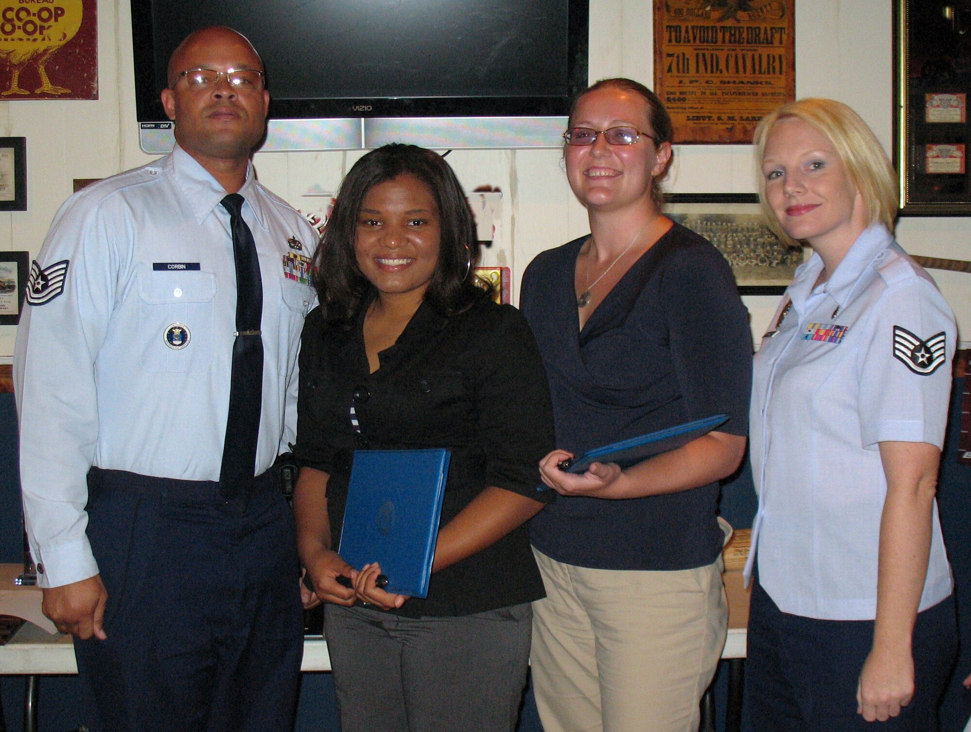 (From left to right) Tech. Sgt. LaCanta Corbin, 341st Recruiting Squadron recruiter; Ms. Romana McKinley; Ms. Adrienne Devore; and Staff Sgt. Cheryl Vercellona, 341st RCS recruiter. Ms. McKinley and Ms. Devore were recently recognized for their support of the Air Force recruiting mission. The future Airmen have been mentoring 10 other potential Air Force applicants and have increased their Armed Services Vocational Aptitude Battery test scores by an average of 18-points. (U.S. Air Force photo/Tech. Sgt. Derek Rivera) 