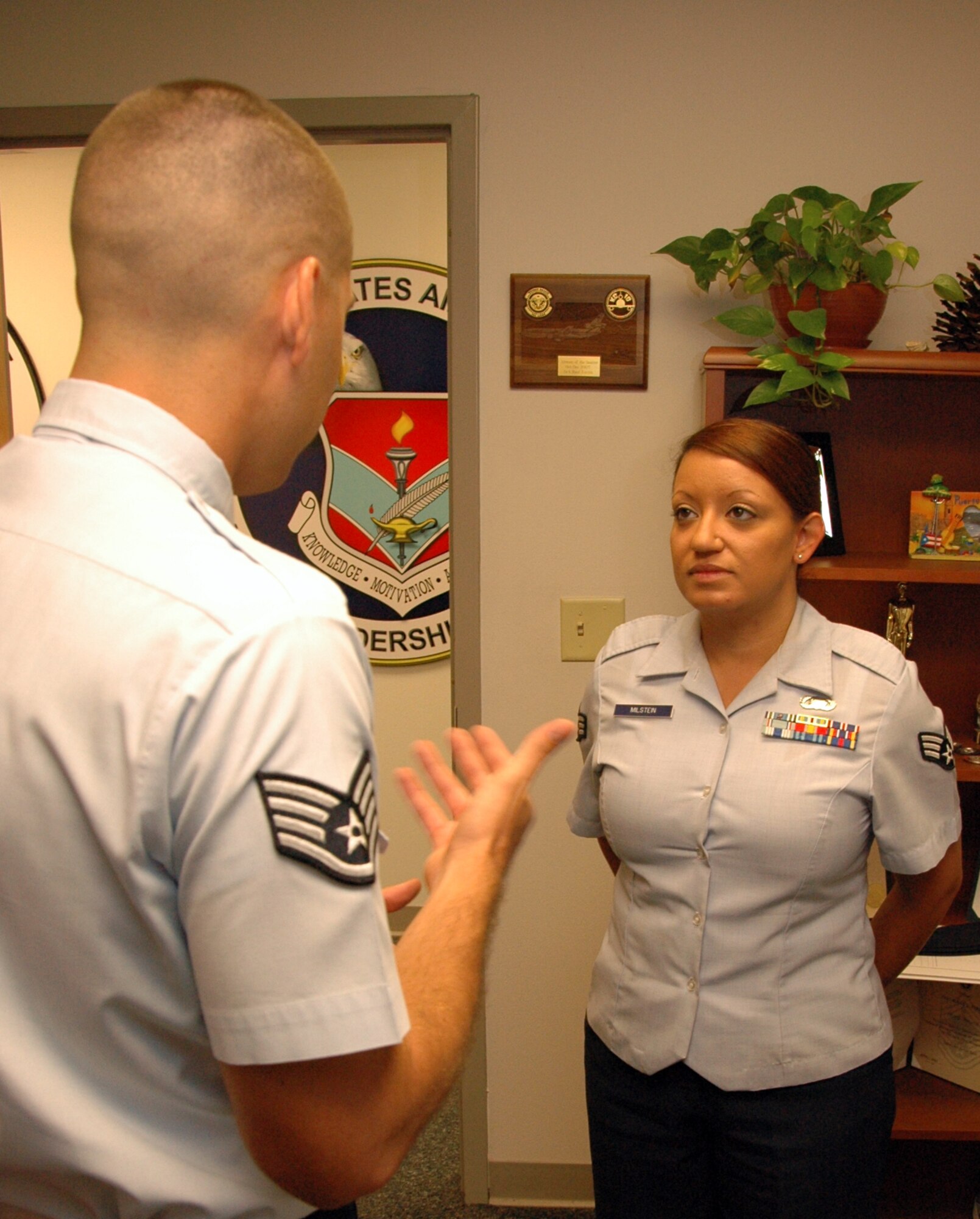 Staff Sgt. Raul Torres, Airmen Leadership School Instructor, evaluates Senior Airman Tara Milstein, from the 68th Electronic Warfare Squadron on her dress and appearance during in-processing on her first day in ALS Sept. 16 here. Airman Milstein is one of 48 students in ALS Class 10-Alpha taking their final step to becoming non-commissioned officers. The Airmen will graduate from ALS Oct. 21. (Air Force photo/Staff Sgt. Bryan Franks)


