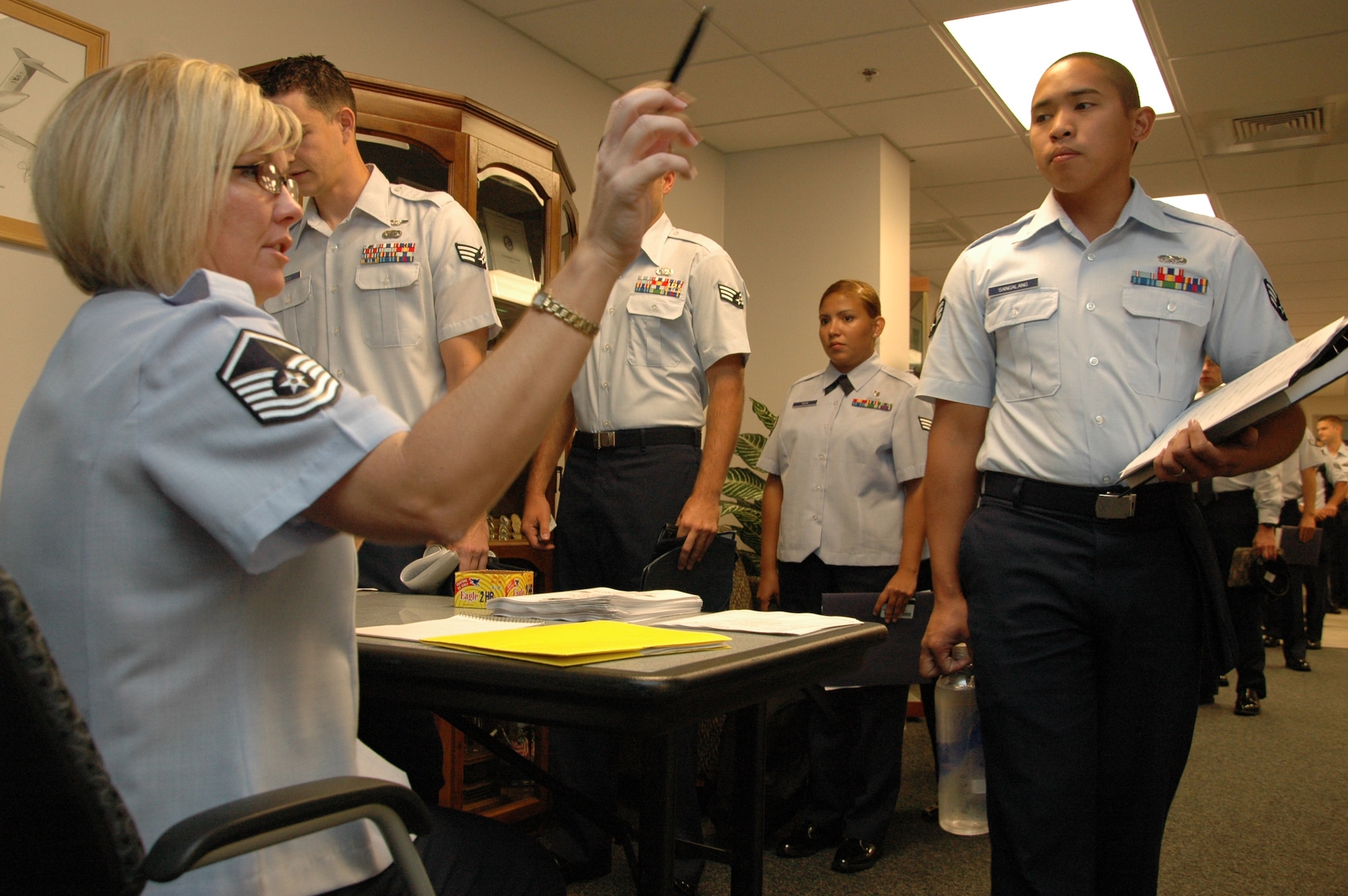 Editor’s note: This is the first in the series following ALS Class 10-Alpha all the way to graduation.  It will show highlights of the month-long class and explain what an Airman experiences during this time.
Master Sgt. Lisa Buckman, Airman Leadership School Commandant, directs new students to uniform inspections during in-processing of ALS Class 10-Alpha here. Class began Sept. 16 for 48 Team Eglin Airmen as they began the path of becoming non-commissioned officers. Eglin’s ALS program was named Air Force ALS Program of the Year for 2008. (Air Force photo/ Staff Sgt. Bryan Franks)
