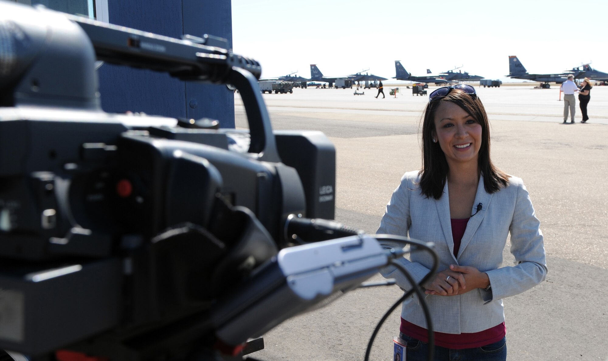 MOUNTAIN HOME AIR FORCE BASE, Idaho -- Nicole Navarro, Ch. 2 CBS News reporter, answers questions during an interview on the flightline Sept. 16. Ms. Navarro won the drawing for an F-15E Strike Eagle incentive ride which will take place at a later date. The goal of media day was to strengthen relationships with local media agencies and give access to the Airmen and mission of the base. (U.S. Air Force photo by Airman 1st Class Debbie Lockhart)