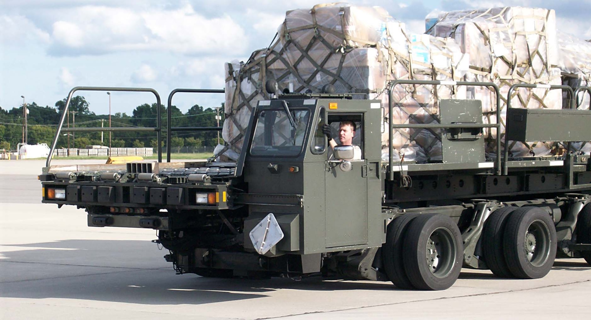 Tech. Sgt. Patrick Mills, 86th Aerial Port, McChord Air Force Base, Wash., prepares to load cargo onto an aircraft with a 60K Tunner New Generation Service Loader while on the readiness assessment team in Norfolk, Va., Aug. 22 to Sept. 4.  (U.S. Air Force photo/Staff Sgt. Mary Hall)