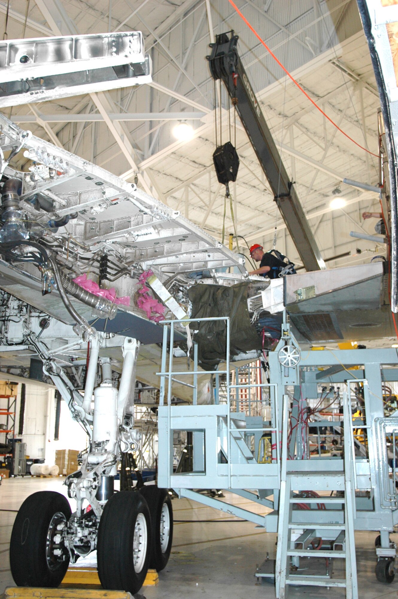 The process is complicated because the engines and the engine nacelles must be removed to allow access to the pivot pins. Balsa wood is built in to plug any gaps and keep liquid nitrogen from pouring out. Heating blankets were also placed to heat and expand the structure surrounding the pin. (Air Force photo by Howdy Stout)
