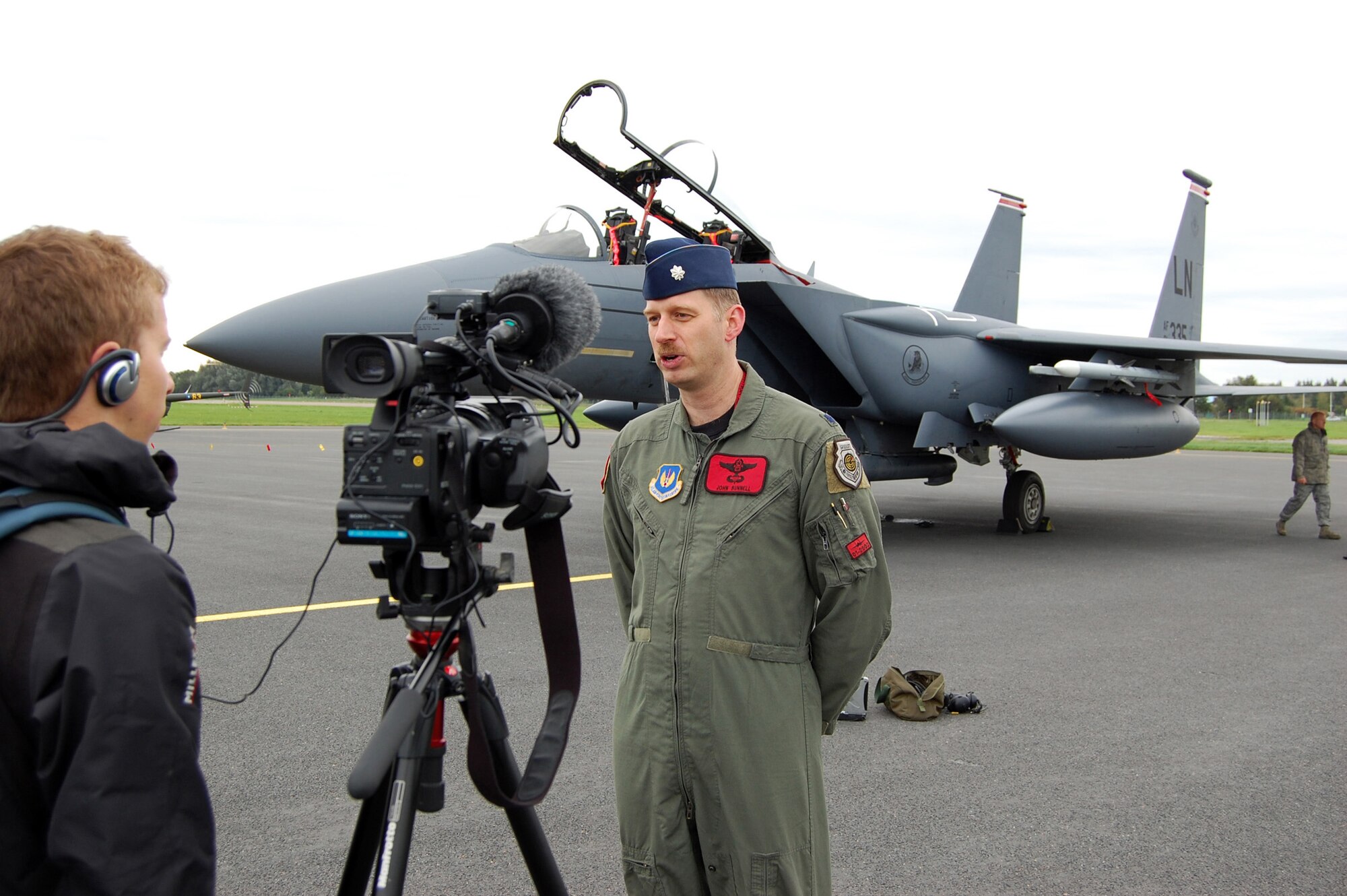 Lt. Col. John Bunnell is interviewed by a NATO reporter Sept. 15, 2009 at Tallinn International Airport, Estonia. Colonel Bunnell is the 494th Fighter Squadron commander from Royal Air Force Lakenheath, England. (U.S. Air Force photo/Master Sgt. Gino Mattorano) 