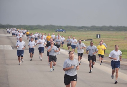 SOTO CANO AIR BASE, Honduras — Runners make the turn down the back stretch of the runway during the Air Force's 62nd birthday celebration 5k run here Sept. 18.  About 175 Soldiers, Sailors and Airmen participated in the 5k run around the base runway. Spc. Al Lawrence, JTF-Bravo Medical Element logistics flight, led the men with a time of 20:54. Command Sgt. Maj. Carlos Escalera, 1st Battalion, 228th Aviation’s Regiment command sergeant major, came in a close second with a time of 20:57. Air Force 1st Lt. Jennifer Richard, JTF-Bravo public affairs officer, led the women with a time of 22:11(U.S. Air Force photo/Staff Sgt. Chad Thompson).
