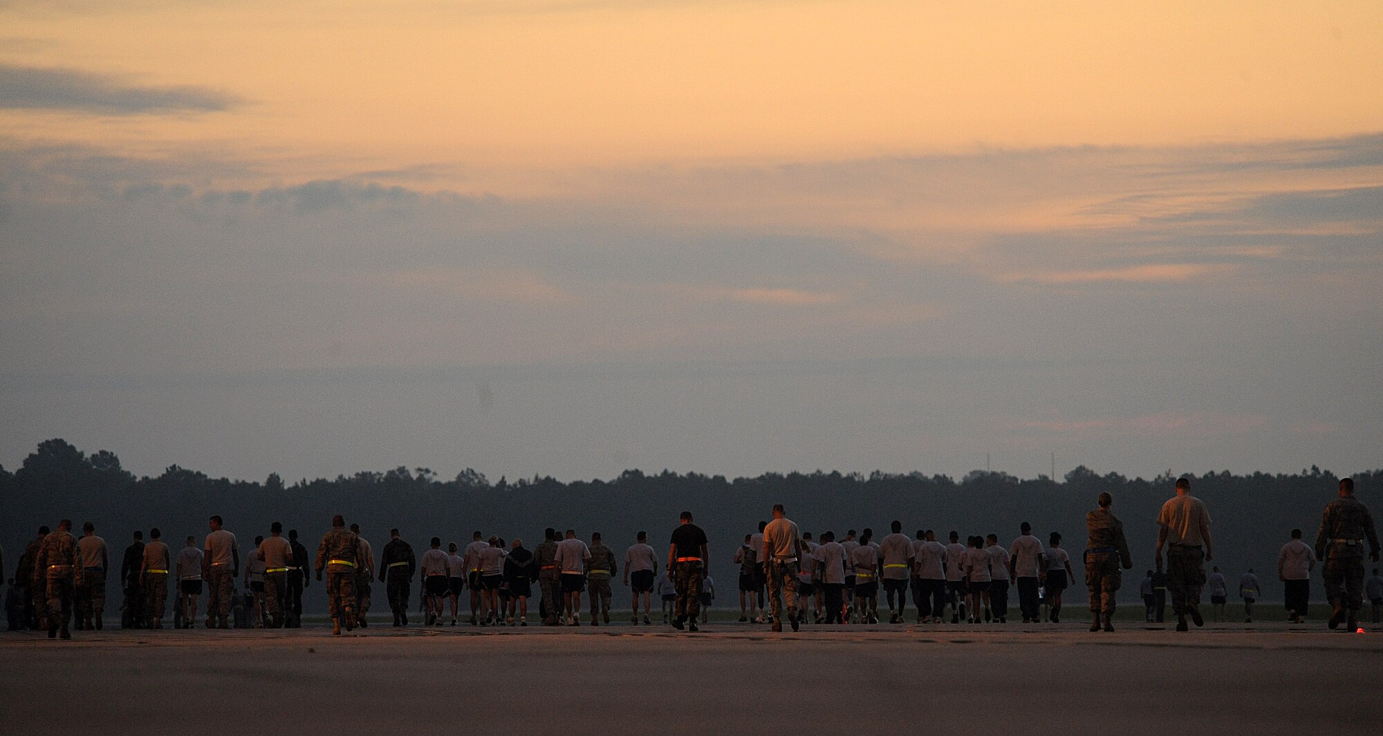 MOODY AIR FORCE BASE Ga. -- Airmen from Moody walk the flightline during a foreign object debris walk here Sept. 18. Participants picked up any trash or loose gravel in preparation for the upcoming Operational Readiness Inspection. (U.S. Air Force photo by Airman 1st Class Joshua Green)