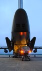 A C-5, one of the largest aircraft in the Air Force inventory, is being loaded at daybreak Sunday with equipment belonging to the 908th Airlift Wing. Maxwell personnel went to 24-hour operations Saturday to load and process the 908th for a deployment exercise in preparation of the Wing’s December Operational Readiness Inspection. (U.S. Air Force photo/Jamie Pitcher)
