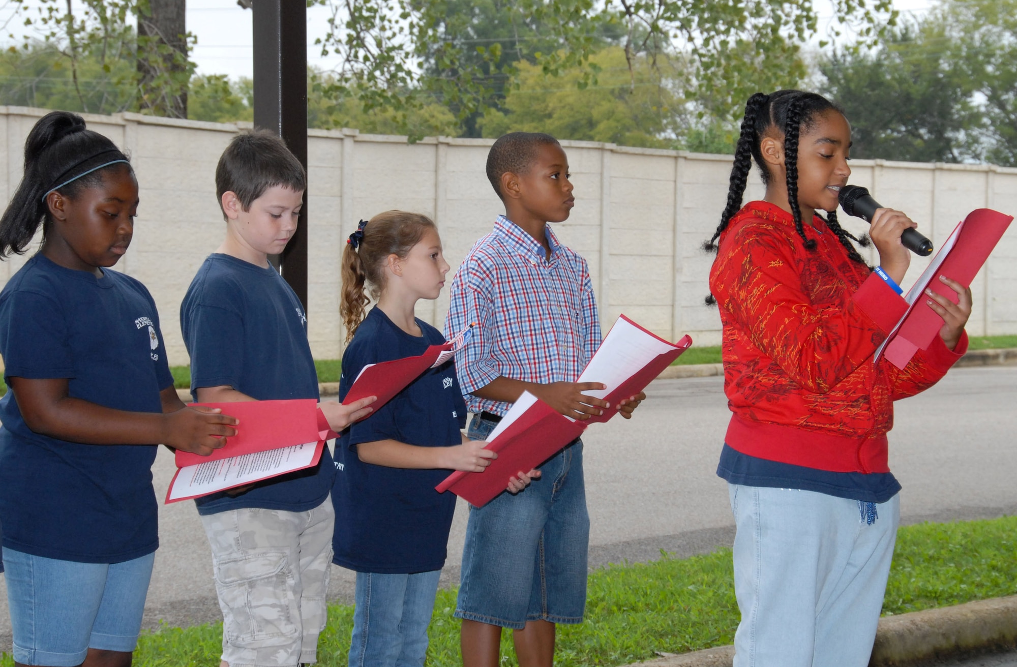 The Maxwell Elementary School held a special ceremony Sept. 11 to remember 9/11. At left are students taking part in the ceremony. They are (from left) D’Andrea Paterson, Michael Boster, Abby Stout, Jaylin Hammond and Micaiah Bulluck. (U.S. Air Force photo/Bud Hancock) 
