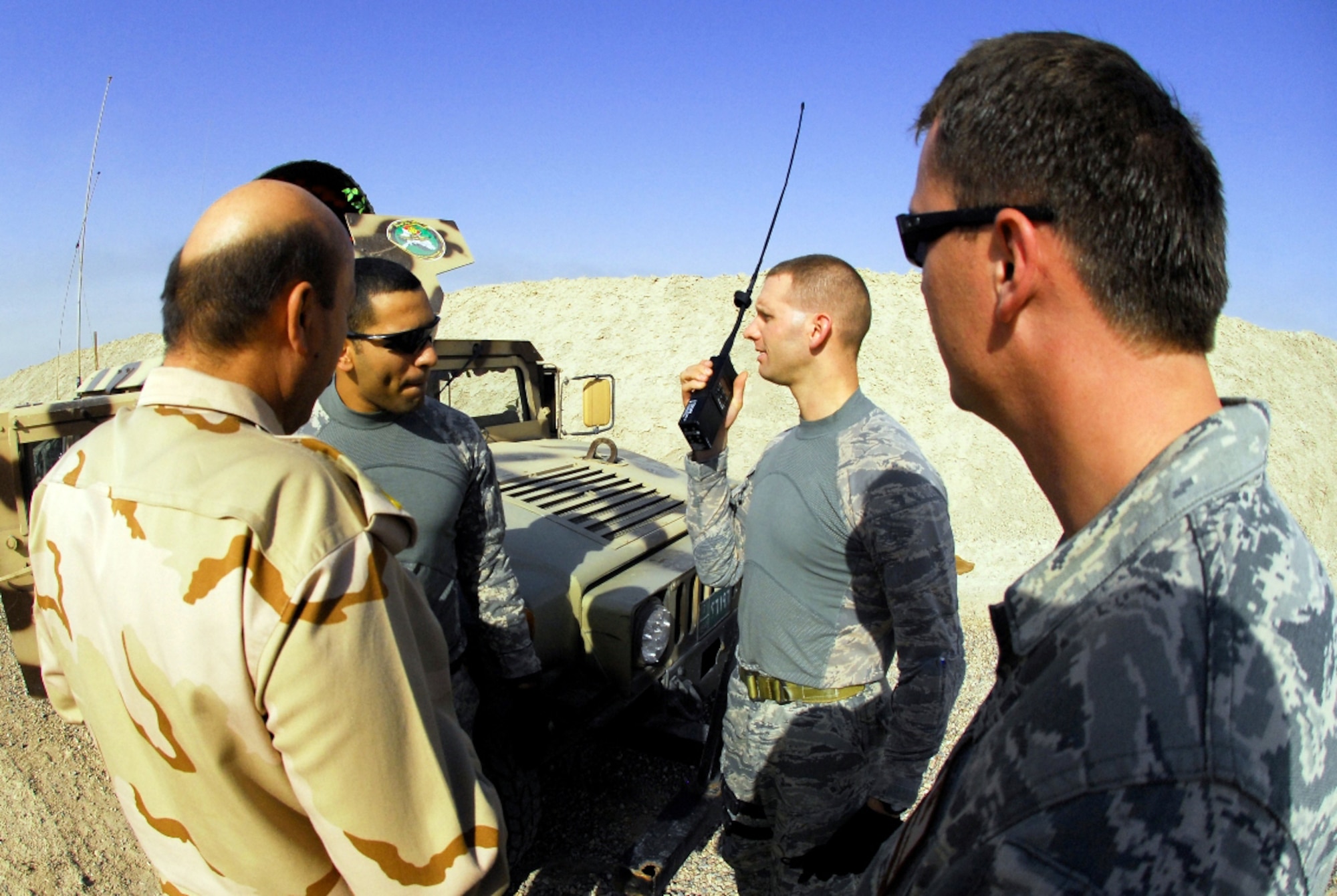 Maj. Lee Dewald ensures radio connectivity between aircraft and ground forces is possible at all times during a training exercise between Iraqi army and air force units at Camp Wessam, Iraq, Sept. 12, 2009. Major Dewald is an air liaison officer for the 84th Expeditionary Air Support Operation Squadron. (U.S. Army photo/Spc. Darryl L. Montgomery)
