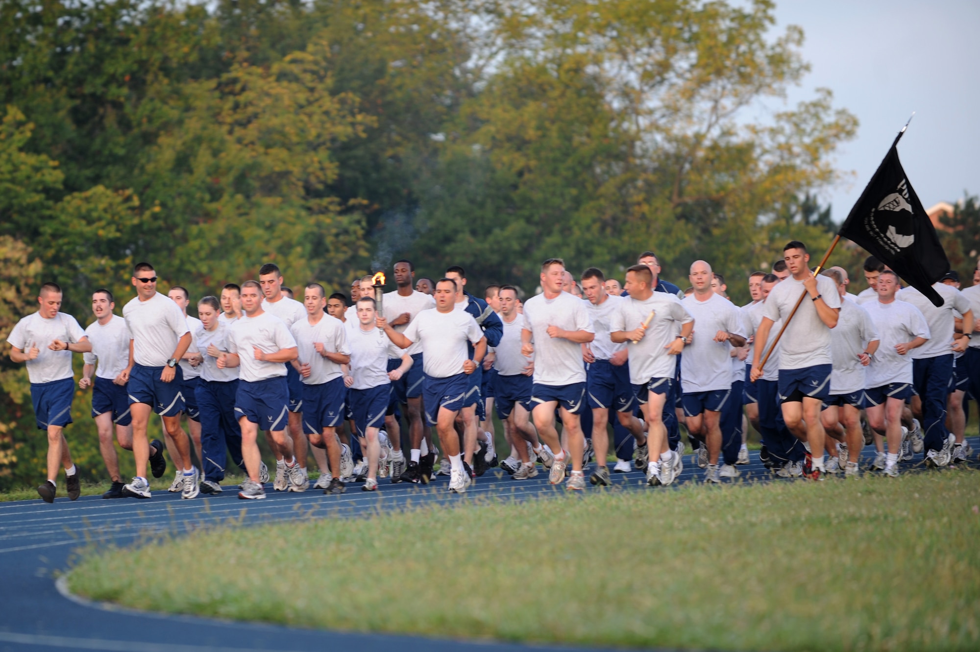 WHITEMAN AIR FORCE BASE, Mo. – Members of the 509th Maintenance Group runs their portion of the POW/MIA run, Sept. 18. The POW/MIA run is a 24-hour torch run to honor prisoners of war and missing-in-action personnel (U.S. Air Force photo/Senior Airman Cory Todd)
