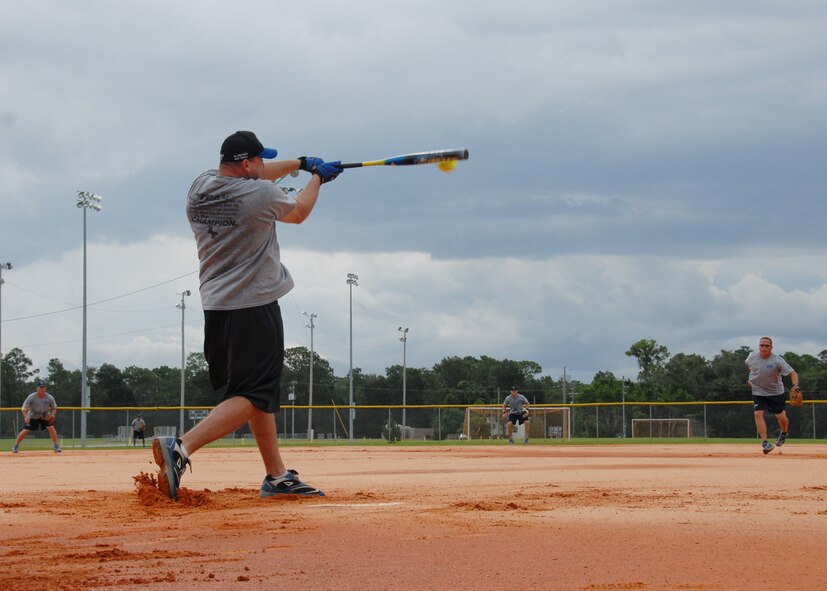 Master Sgt. Chadd Malin connects during an Air Force Softball Team practice session Sept. 16 at Eglin Air Force Base.  Eglin is the site for tryouts and practices leading up to the All Services Tournament held in Pensacola, Fla., beginning Sept. 20.  Fifteen Air Force members from 11 different bases made the team this year.  Four ‘rookies’ made the team this year along with 11 team veterans.  (U.S. Air Force photo/Samuel King Jr.)