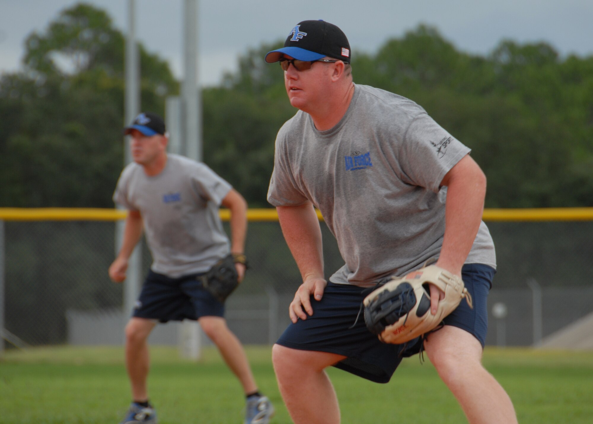 Staff Sgt. Josh Wiggs and Tech. Sgt. Rich Mercer get ready for the swing of the bat during an Air Force Softball Team practice session Sept. 16 at Eglin Air Force Base.  Eglin is the site for tryouts and practices leading up to the All Services Tournament held in Pensacola, Fla., beginning Sept. 20.  Fifteen Air Force members from 11 different bases made the team this year.  Four ‘rookies’ made the team this year along with 11 team veterans.  (U.S. Air Force photo/Samuel King Jr.)