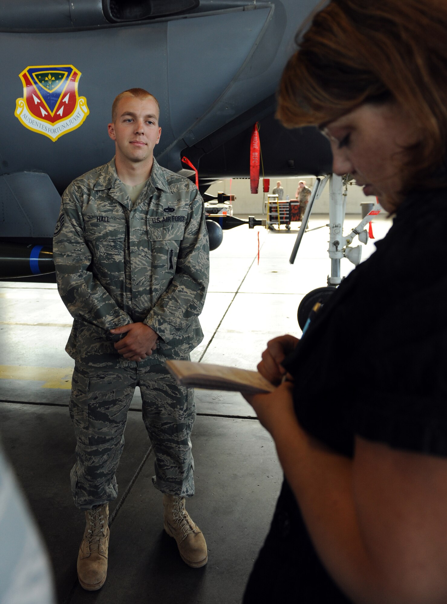 MOUNTAIN HOME AIR FORCE BASE, Idaho -- Staff Sgt. Joseph Hall, 391st Aircraft Maintenance Unit load crew team chief, answers questions from Katy Kreller, Idaho Statesman reporter, during a media day visit Sept. 16. The goal of media day was to strengthen relationships with local media agencies and give access to the Airmen and mission of the base. (U.S. Air Force photo by Airman 1st Class Debbie Lockhart)