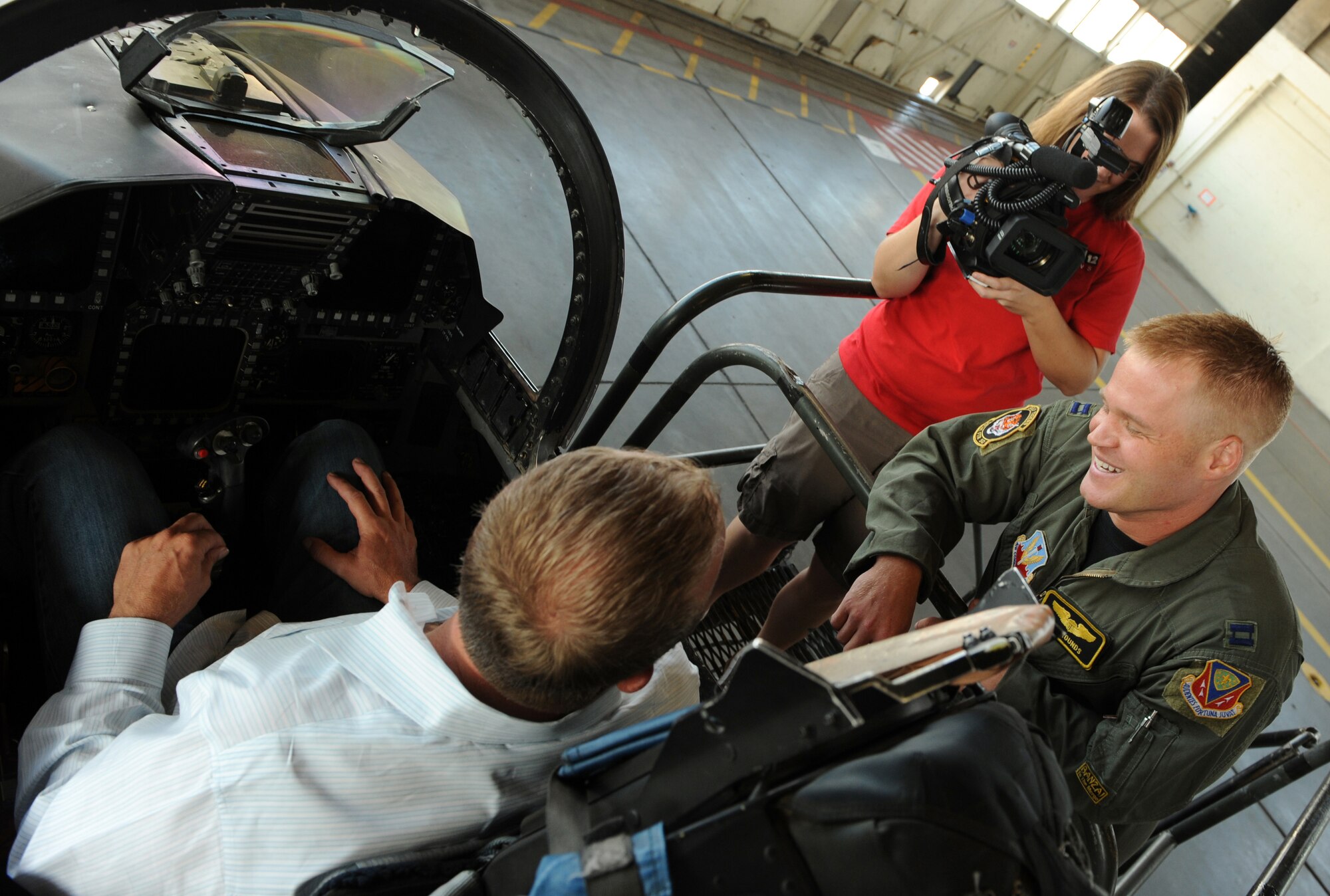 MOUNTAIN HOME AIR FORCE BASE, Idaho -- Capt. Ray Rounds, 391st Fighter Squadron pilot, answers questions from Mike Vogel, Ch. 12 FOX News reporter, and Jill Hardy, Ch. 12 FOX News cameraman, during a media day visit Sept. 16. The goal of media day was to strengthen relationships with local media agencies and give access to the Airmen and mission of the base. (U.S. Air Force photo by Airman 1st Class Debbie Lockhart)