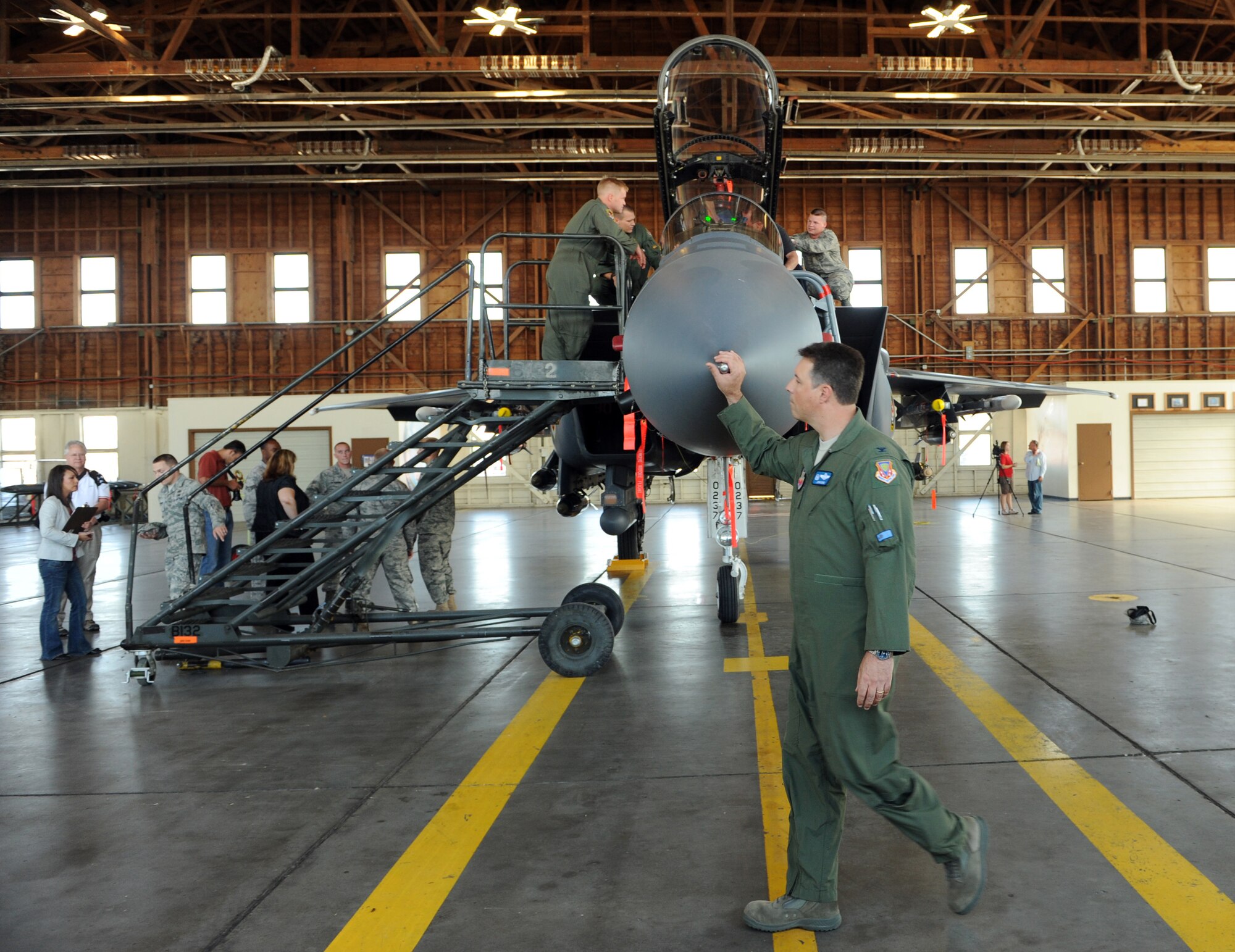 MOUNTAIN HOME AIR FORCE BASE, Idaho -- Col. John Bird, 366th Fighter Wing commander, walks in front of an F-15E Strike Eagle as he visits with each of the media outlets during media day Sept. 16. The goal of media day was to strengthen relationships with local media agencies and give access to the Airmen and mission of the base. (U.S. Air Force photo by Airman 1st Class Debbie Lockhart)