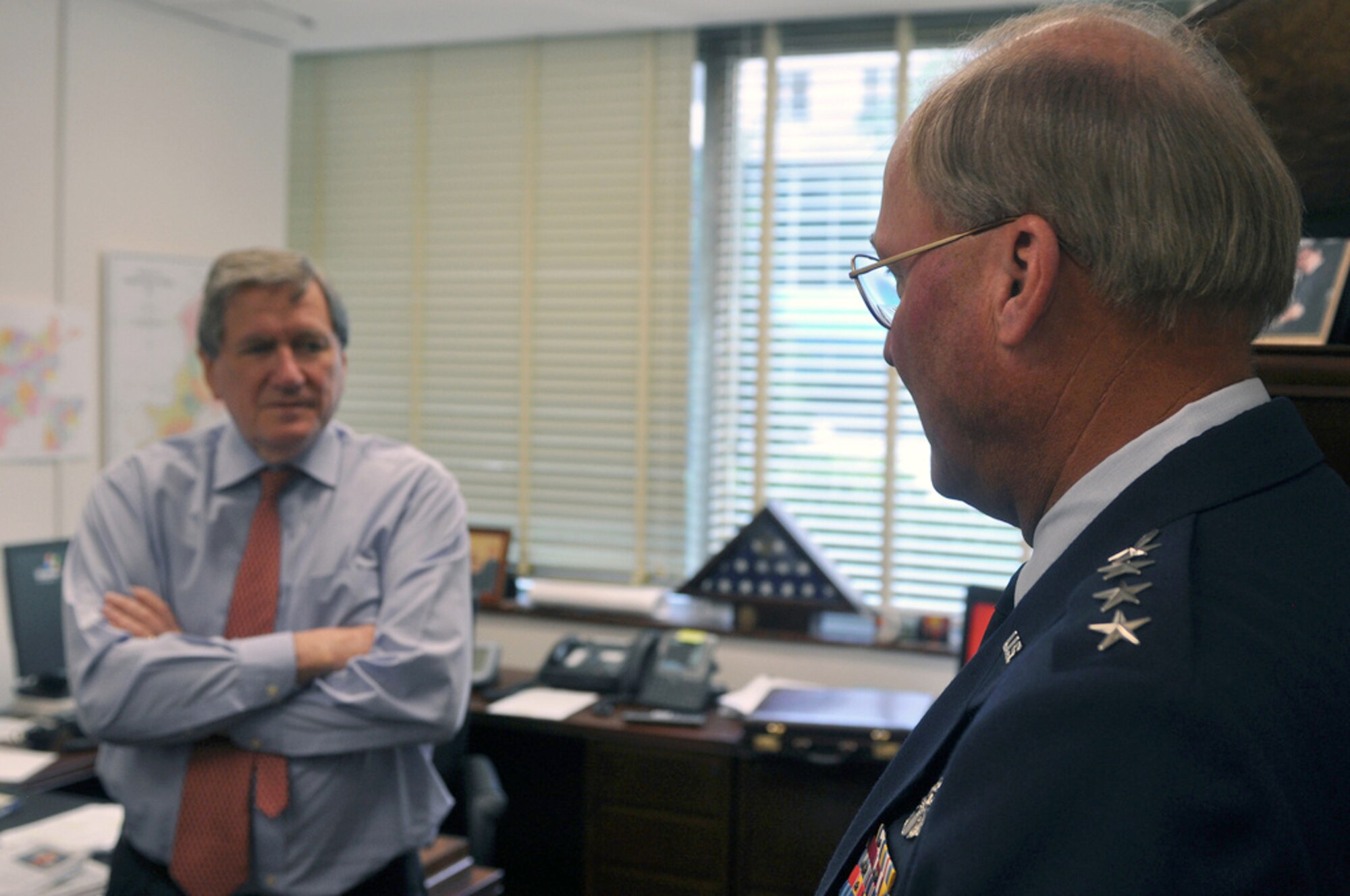 Gen. Craig McKinley (right), chief of the National Guard Bureau, meets with Richard Holbrooke, special representative for Afghanistan and Pakistan, Sept. 14, 2009 during a visit to the State Department. The two discussed National Guard Agribusiness Development Teams at work in Aghanistan and National Guard training of civilian advisors for Afghanistan at the Indiana National Guard's Muscatatuck Urban Training Center. (U.S. Army photo/Staff Sgt. Jim Greenhill)