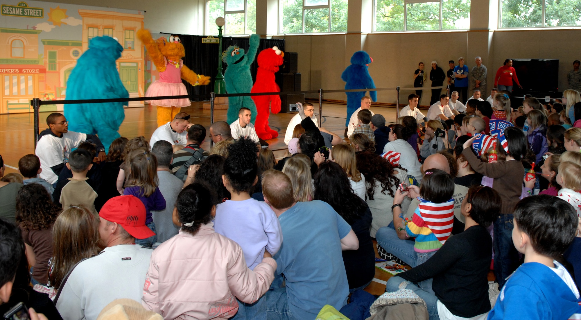 SPANGDAHLEM AIR BASE, Germany –Sesame Street characters perform live at the Bitburg gym for a full house of children and their families Sept. 16. The Sesame Street Experience is a free traveling USO-sponsored tour dedicated to helping military families deal with the emotional stresses that come with being a military parent or child of a deployed servicemember. Bitburg Annex was the fourth stop on the group’s European tour with 16 bases remaining.  (U.S. Air Force photo/Airman 1st Class Staci Miller)