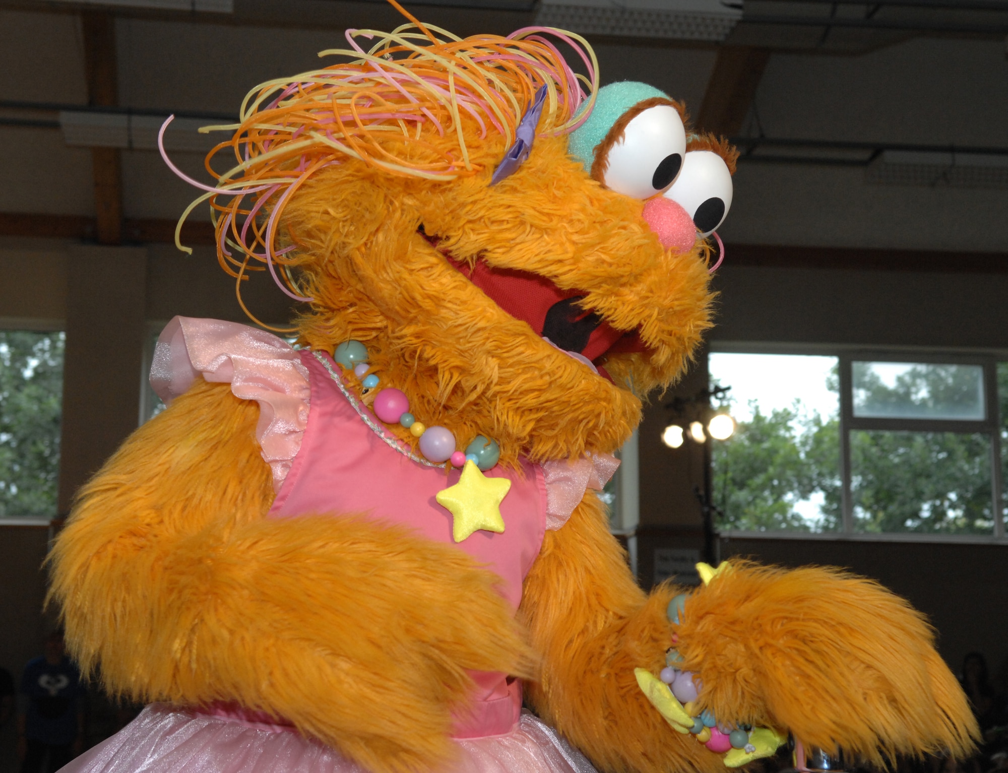 SPANGDAHLEM AIR BASE, Germany – Zoe, a Sesame Street character, performs live at the Bitburg gym for a full house of children and their families Sept. 16. The Sesame Street Experience is a free traveling USO-sponsored tour dedicated to helping military families deal with the emotional stresses that come with being a military parent or child of a deployed servicemember. Bitburg Annex was the fourth stop on the group’s European tour with 16 bases remaining.  (U.S. Air Force photo/Airman 1st Class Staci Miller)