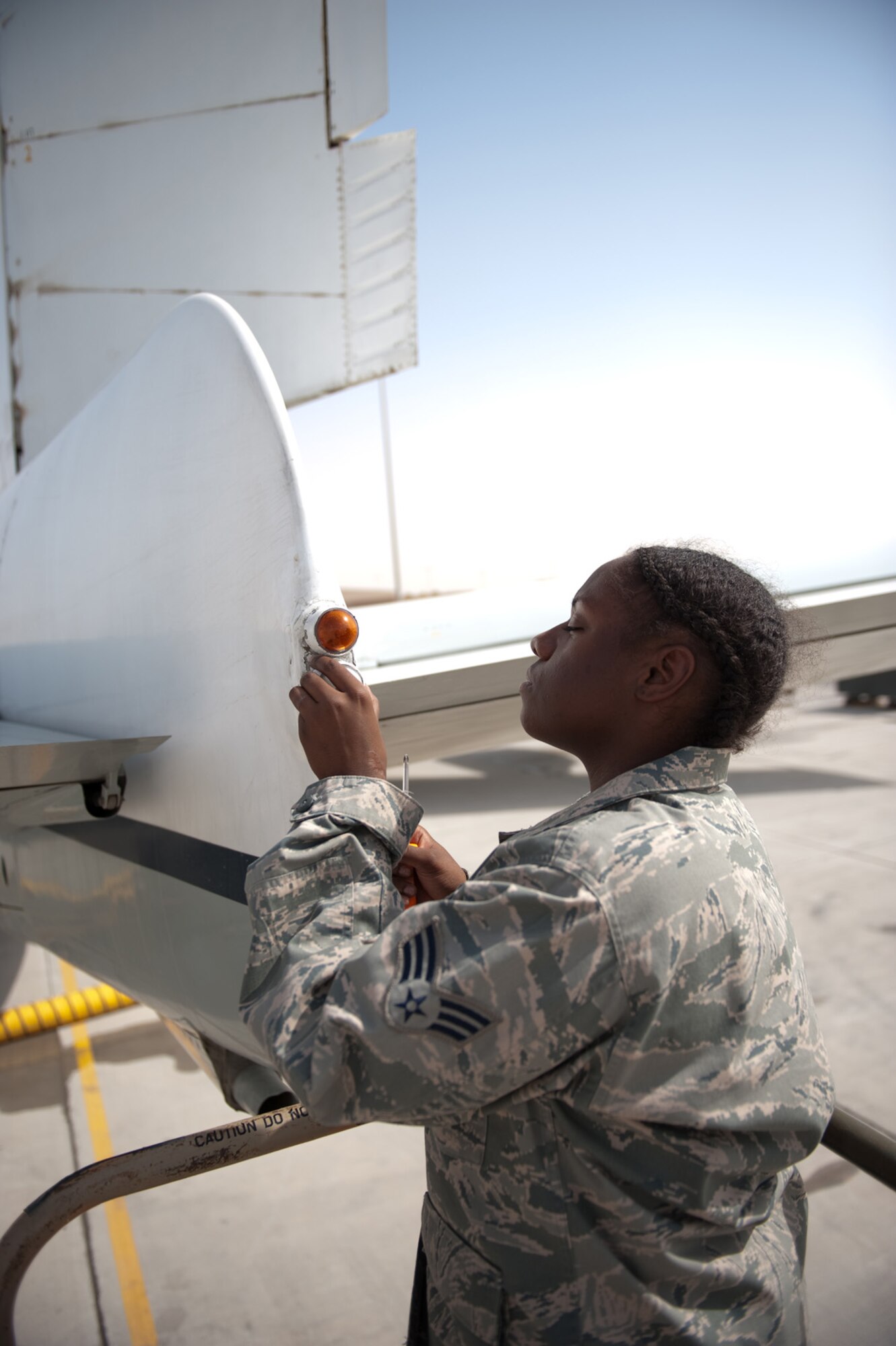 Senior Airman Kirshell LaCroix, 55th Aircraft Maintenance Unit electronic and environmental journeyman, replaces a tail light on an RC-135 Rivet Joint, Sept. 16, in Southwest Asia. The 55 AMU maintains the RC-135 Rivet Joint, an intelligence, surveillance and reconnaissance platform that provides near real time on-scene intelligence collection, analysis and dissemination capabilities in support of Operations Iraqi and Enduring Freedom. Airman LaCroix is deployed from Offutt Air Force Base, Neb. (U.S. Air Force photo/Staff Sgt. Robert Barney)