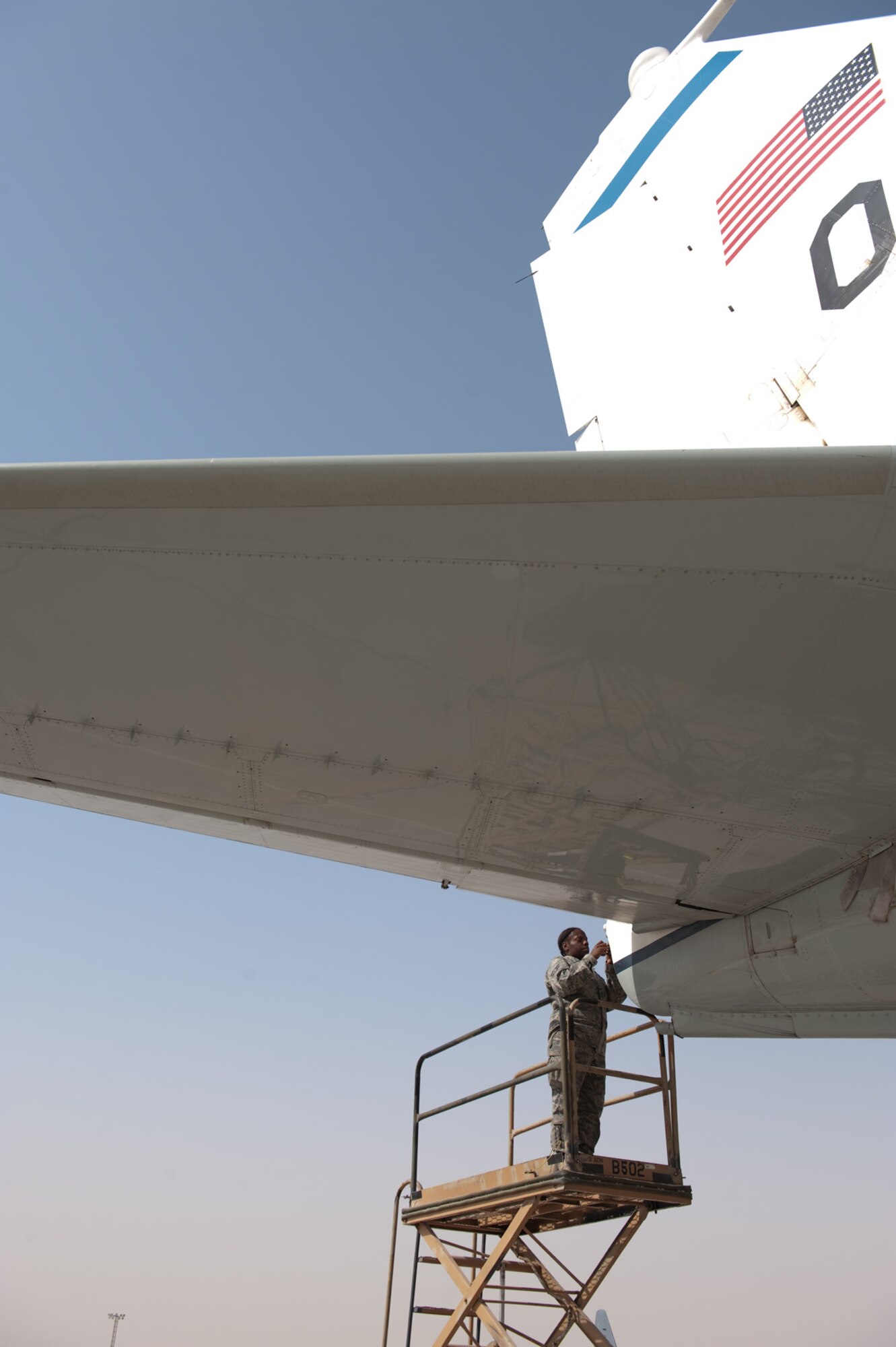 Senior Airman Kirshell LaCroix, 55th Aircraft Maintenance Unit electronic and environmental journeyman, replaces a tail light on an RC-135 Rivet Joint, Sept. 16, in Southwest Asia. The 55 AMU maintains the RC-135 Rivet Joint, an intelligence, surveillance and reconnaissance platform that provides near real time on-scene intelligence collection, analysis and dissemination capabilities in support of Operations Iraqi and Enduring Freedom. Airman LaCroix is deployed from Offutt Air Force Base, Neb. (U.S. Air Force photo/Staff Sgt. Robert Barney)