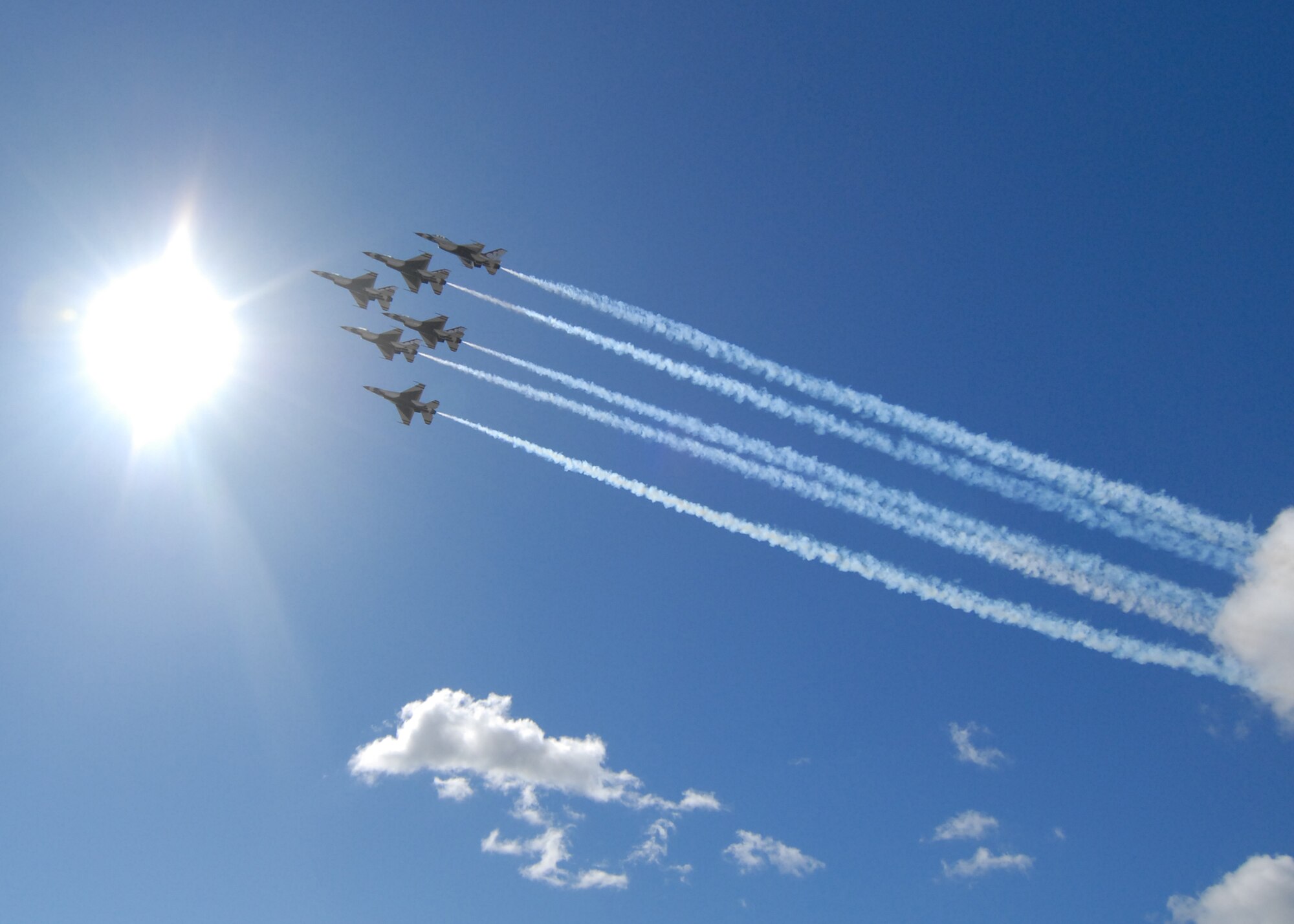 HICKAM AIR FORCE BASE, Hawaii -- The Thunderbirds, U.S. Air Force Demonstration Squadron, arrive in typical style over Hickam Air Force Base, Hawaii, during their initial arrival for "Wings Over the Pacific," Sept. 16. The Thunderbirds will demonstrate the capabilities the F-16 Fighting Falcon by performing combat maneuvers during their aerial portion of the weekend event Sept. 19-20. This is Hickam?s first open house since 2003, and a crowd of more than 120,000 are expected to visit during the weekend.  (U.S. Air Force photo/Staff Sgt. Mike Meares)