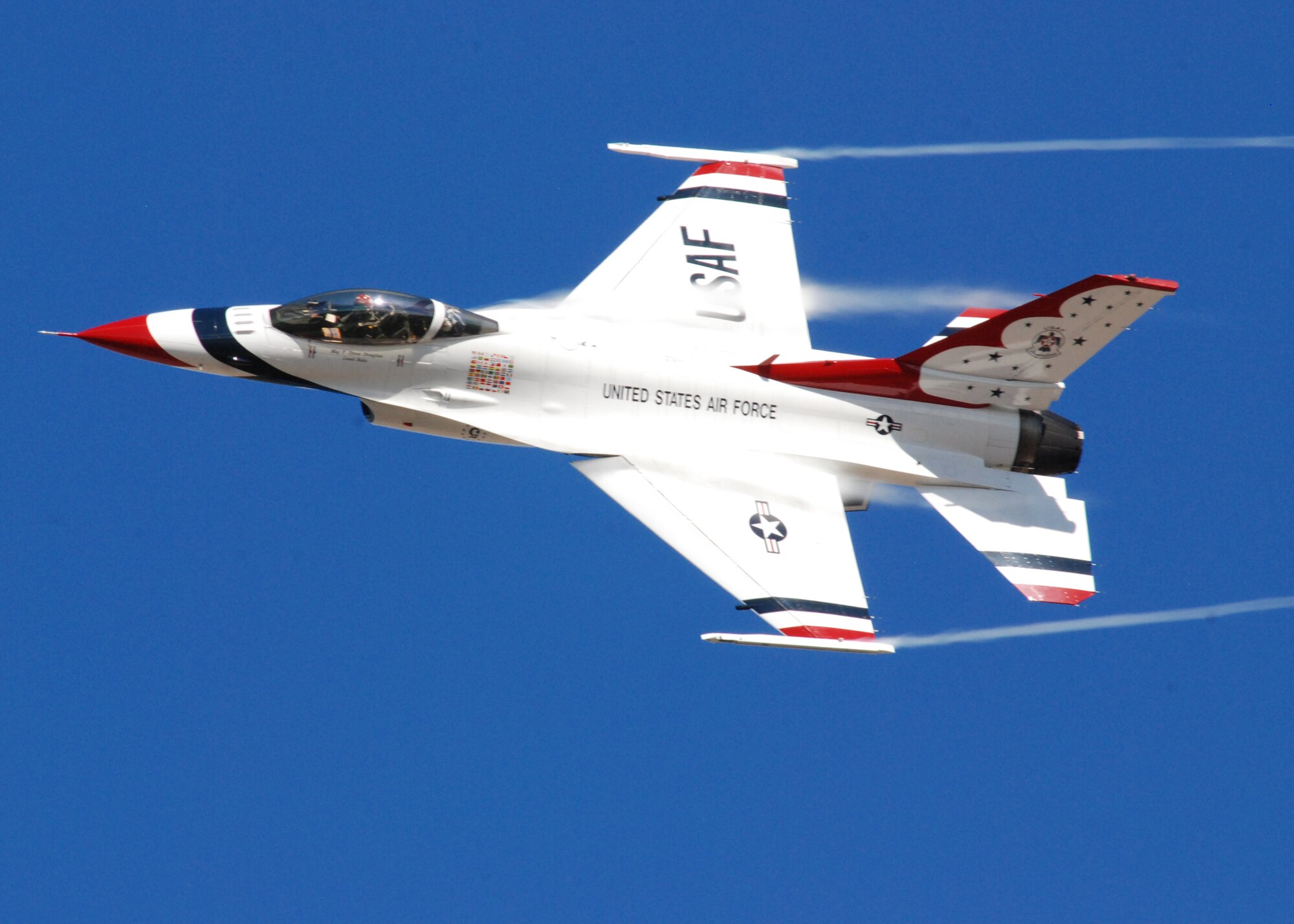 HICKAM AIR FORCE BASE, Hawaii -- The Thunderbirds, U.S. Air Force Demonstration Squadron, arrive in typical style over Hickam Air Force Base, Hawaii, during their initial arrival for "Wings Over the Pacific," Sept. 16. The Thunderbirds will demonstrate the capabilities the F-16 Fighting Falcon by performing combat maneuvers during their aerial portion of the weekend event Sept. 19-20. This is Hickam?s first open house since 2003, and a crowd of more than 120,000 are expected to visit during the weekend.  (U.S. Air Force photo/Staff Sgt. Mike Meares)