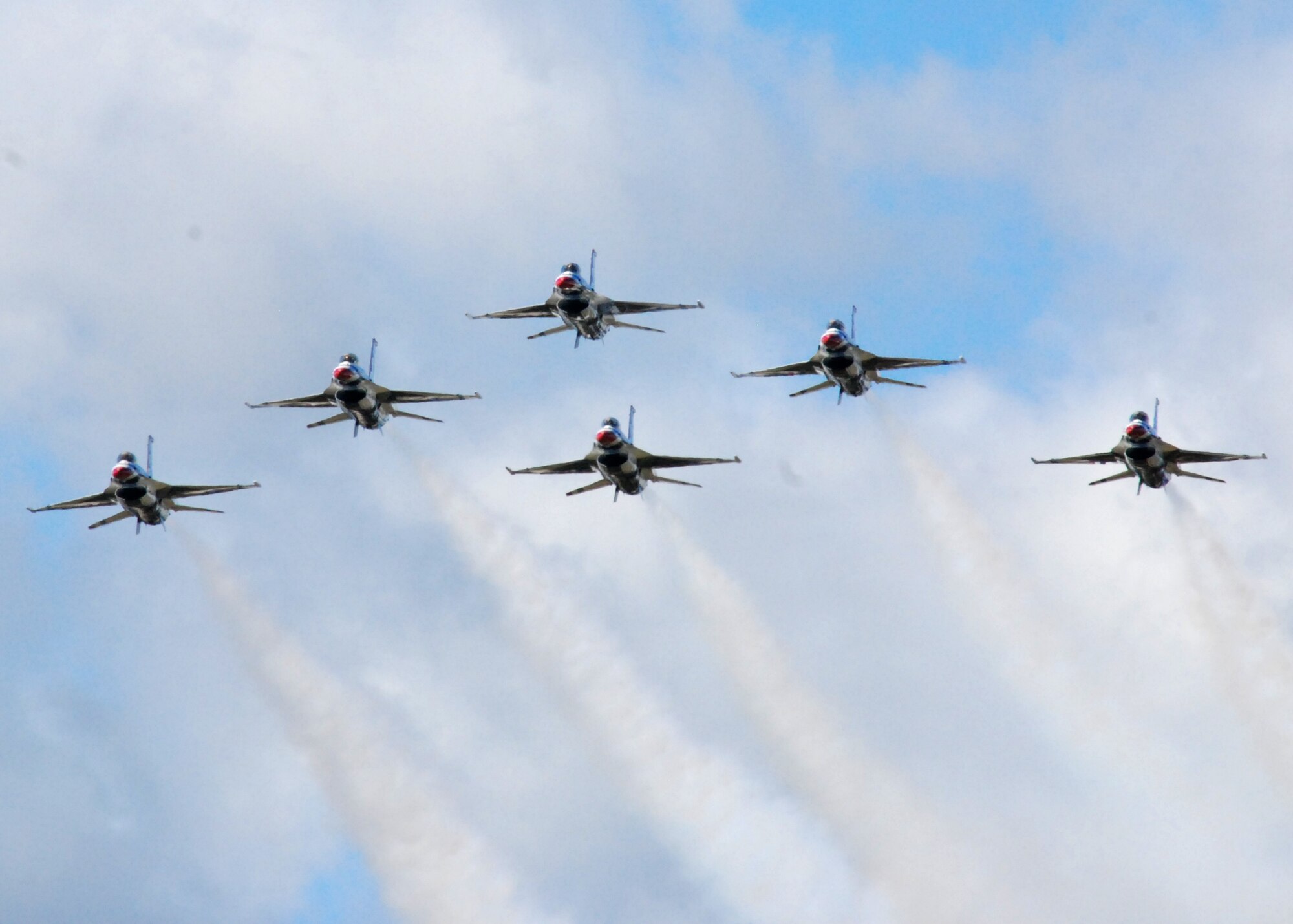 HICKAM AIR FORCE BASE, Hawaii -- The Thunderbirds, U.S. Air Force Demonstration Squadron, arrive in typical style over Hickam Air Force Base, Hawaii, during their initial arrival for "Wings Over the Pacific," Sept. 16. The Thunderbirds will demonstrate the capabilities the F-16 Fighting Falcon by performing combat maneuvers during their aerial portion of the weekend event Sept. 19-20. This is Hickam?s first open house since 2003, and a crowd of more than 120,000 are expected to visit during the weekend.  (U.S. Air Force photo/Staff Sgt. Mike Meares)