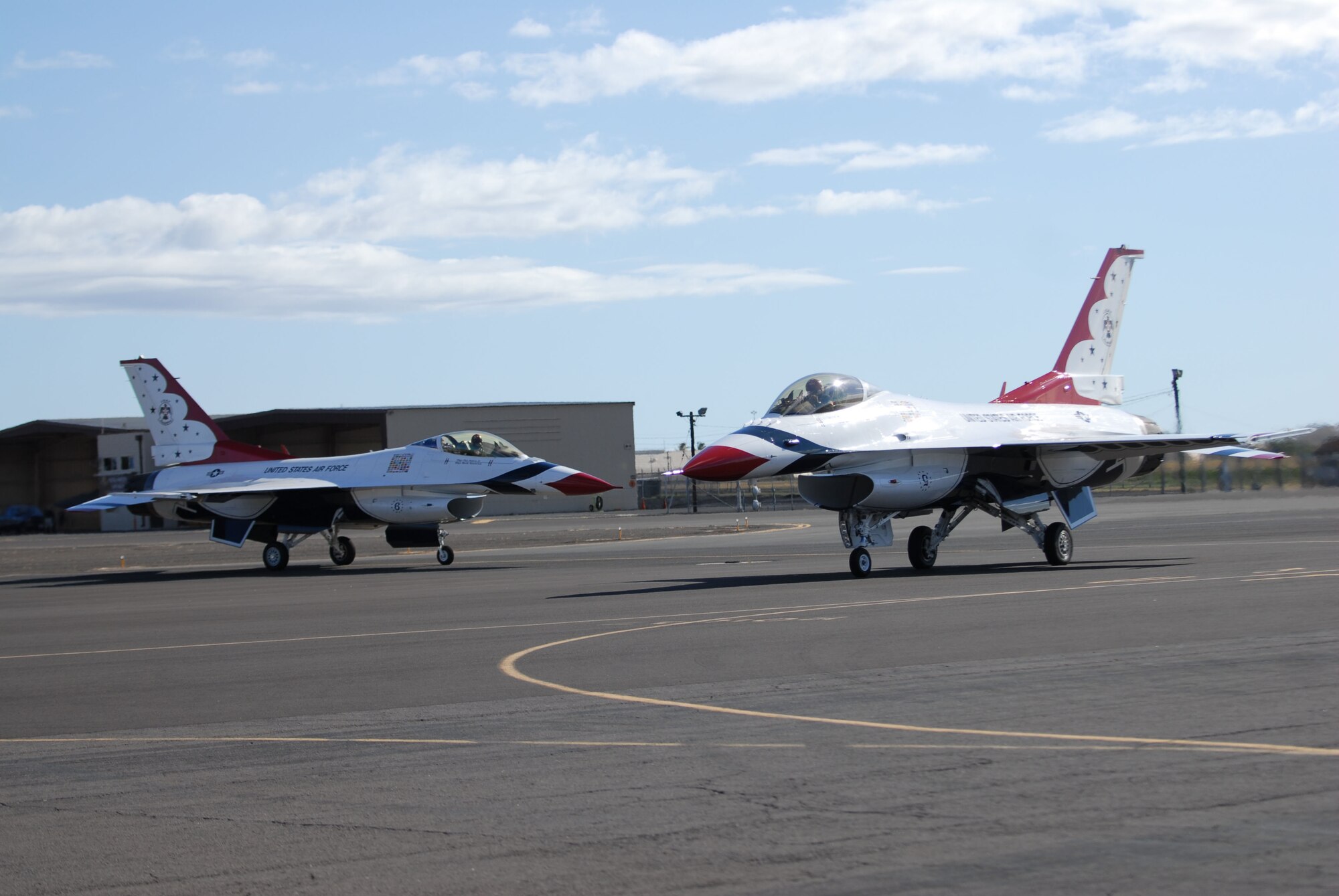 HICKAM AIR FORCE BASE, Hawaii -- Two U.S. Air Force Demonstration Squadron F-16 Thunderbird taxi in after arriving for Open House "Wings over the Pacific" here, Sept. 16. The Open House will feature live band performances, static displays and The Thunderbirds will demonstrate the capabilities the F-16 Fighting Falcon when they preform an air show. (U.S. Air Force photo/Senior Airman Gustavo Gonzalez)