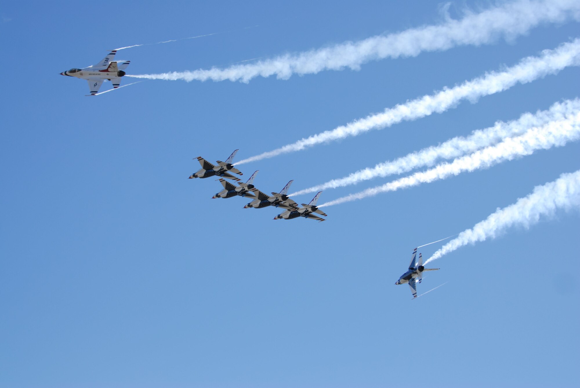 HICKAM AIR FORCE BASE, Hawaii -- The Thunderbirds, U.S. Air Force Demonstration Squadron, perform a maneuver as they arrive for Open House, "Wings over the Pacific" here, Sept. 16. The Open House will feature live band performances, static displays and The Thunderbirds will demonstrate the capabilities the F-16 Fighting Falcon when they preform an air show. (U.S. Air Force photo/Senior Airman Gustavo Gonzalez)