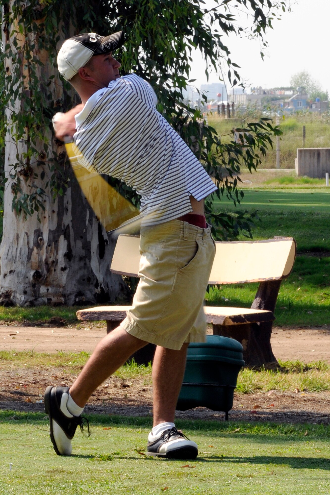 Paul Schone, a 39th Maintenance Squadron aerospace ground equipment mechanic, tees off on the first hole of Hodja Lakes Golf Course during the 2009 Intramural Golf Championship Wednesday, Sept. 16, 2009, at Incirlik Air Base, Turkey.  Schone and the rest of his 39th MXS team won the championship after defeating the team representing the 39th Force Support Squadron.  The win earned the 39th MXS points toward the Commander’s Trophy which is given to the squadron with the most overall points earned in intramural sports at the end of the year.  (U.S. Air Force photo/Staff Sgt. Raymond Hoy)