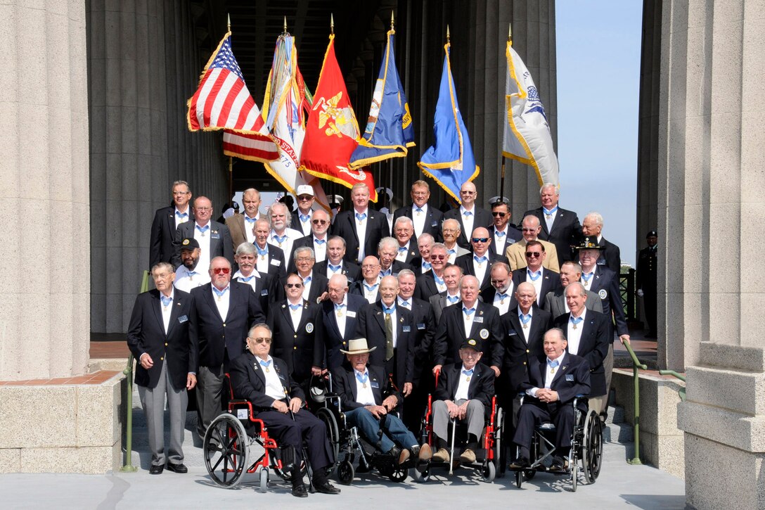 Medal of Honor recipients pose for a group photo shortly before the opening ceremony of the Medal of Honor Convention at Soldier Field, Chicago, Sept 15, 2009.