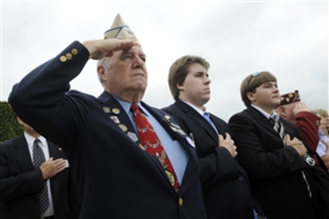 A U.S. Veteran salutes during the playing of the national anthem at the beginning of the National POW/MIA Recognition Day Ceremony at the Pentagon on Sept. 18, 2009.  