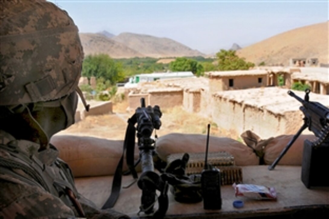 U.S. Army Spc. Olen Bailey stands post in a guard tower on Forward Operating Base Mizan in Zabul province, Afghanistan, Sept. 10, 2009. Bailey is assigned to Company A, 1st Battalion, 4th Infantry Regiment.