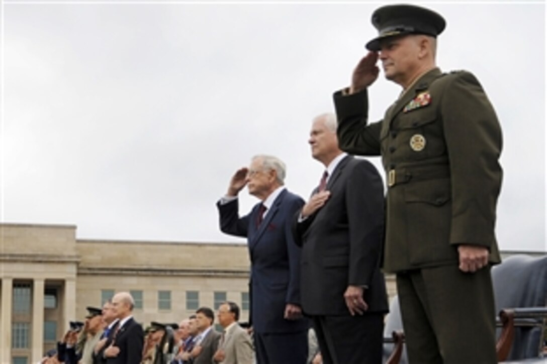 Right to left, Marine Gen. James E. Cartwright, vice chairman of the Joint Chiefs of Staff, Defense Secretary Robert M. Gates and retired Rear Adm. Jeremiah A. Denton Jr. render honors during the playing of the national anthem during the National POW/MIA Recognition Day ceremony at the Pentagon, Sept. 18, 2009.