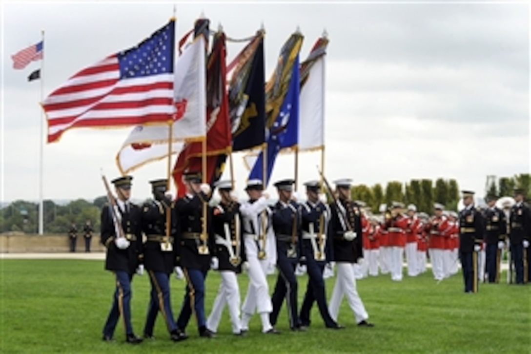 Members of a joint color guard march onto the field during the National POW/MIA Recognition Day ceremony at the Pentagon, Sept. 18, 2009. 