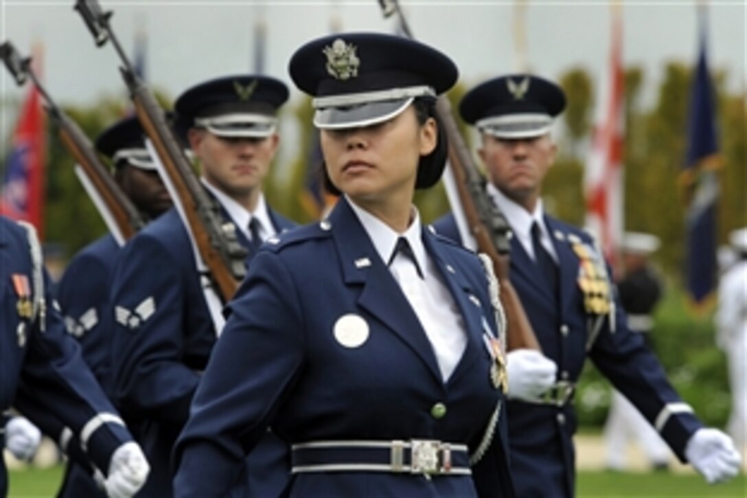 U.S. Air Force airmen conduct a march-in-review during the National POW/MIA Recognition Day ceremony at the Pentagon, Sept. 18, 2009. 